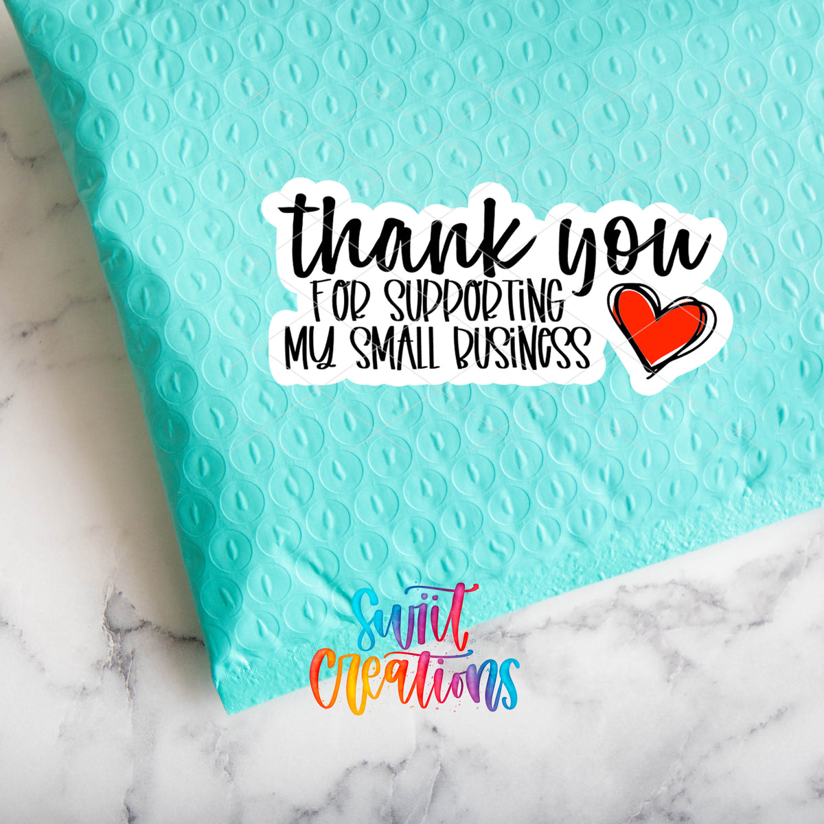 a blue envelope with a thank you for shopping my small business sticker on it