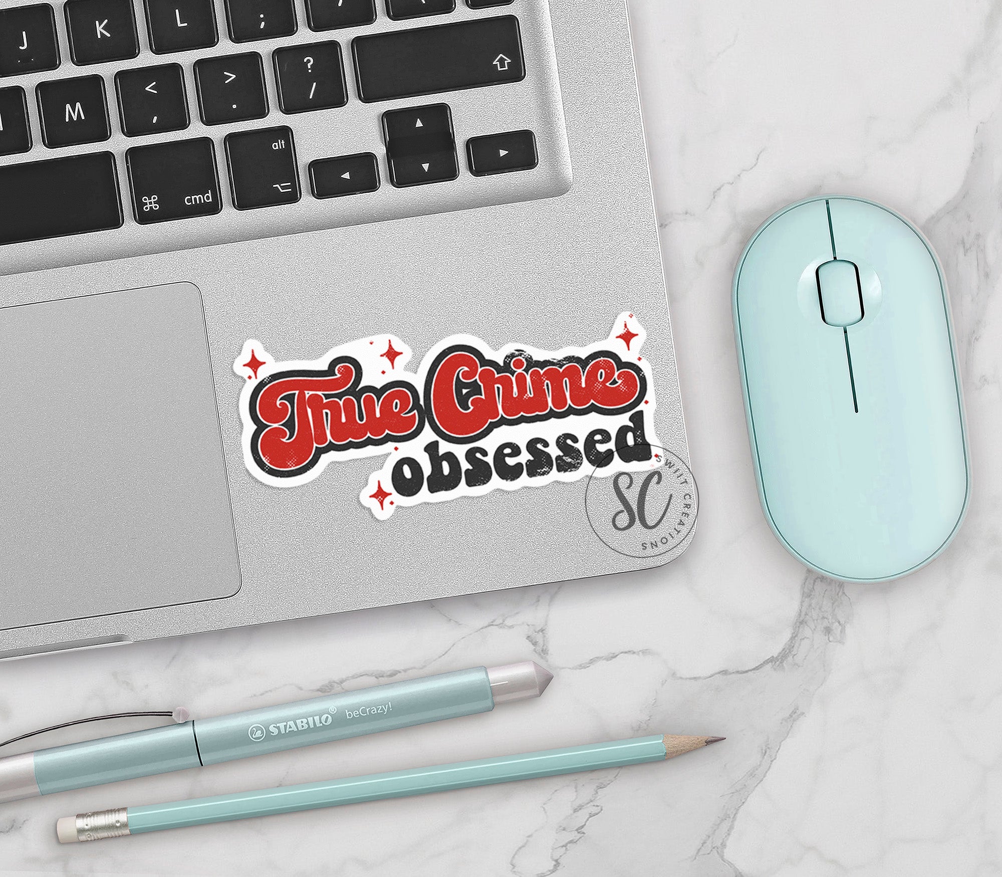 a laptop computer sitting on top of a white table