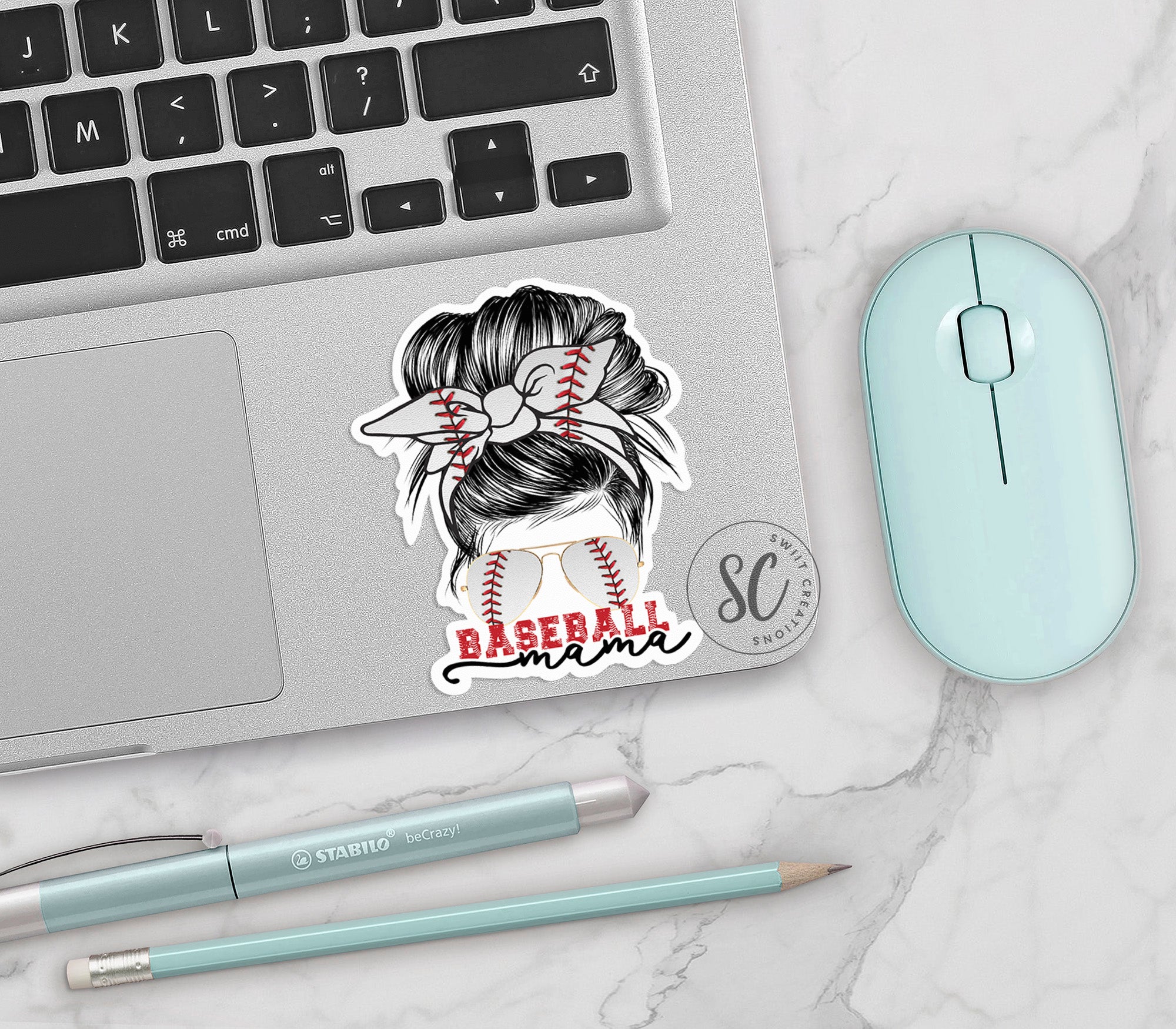 a laptop with a sticker of a baseball player