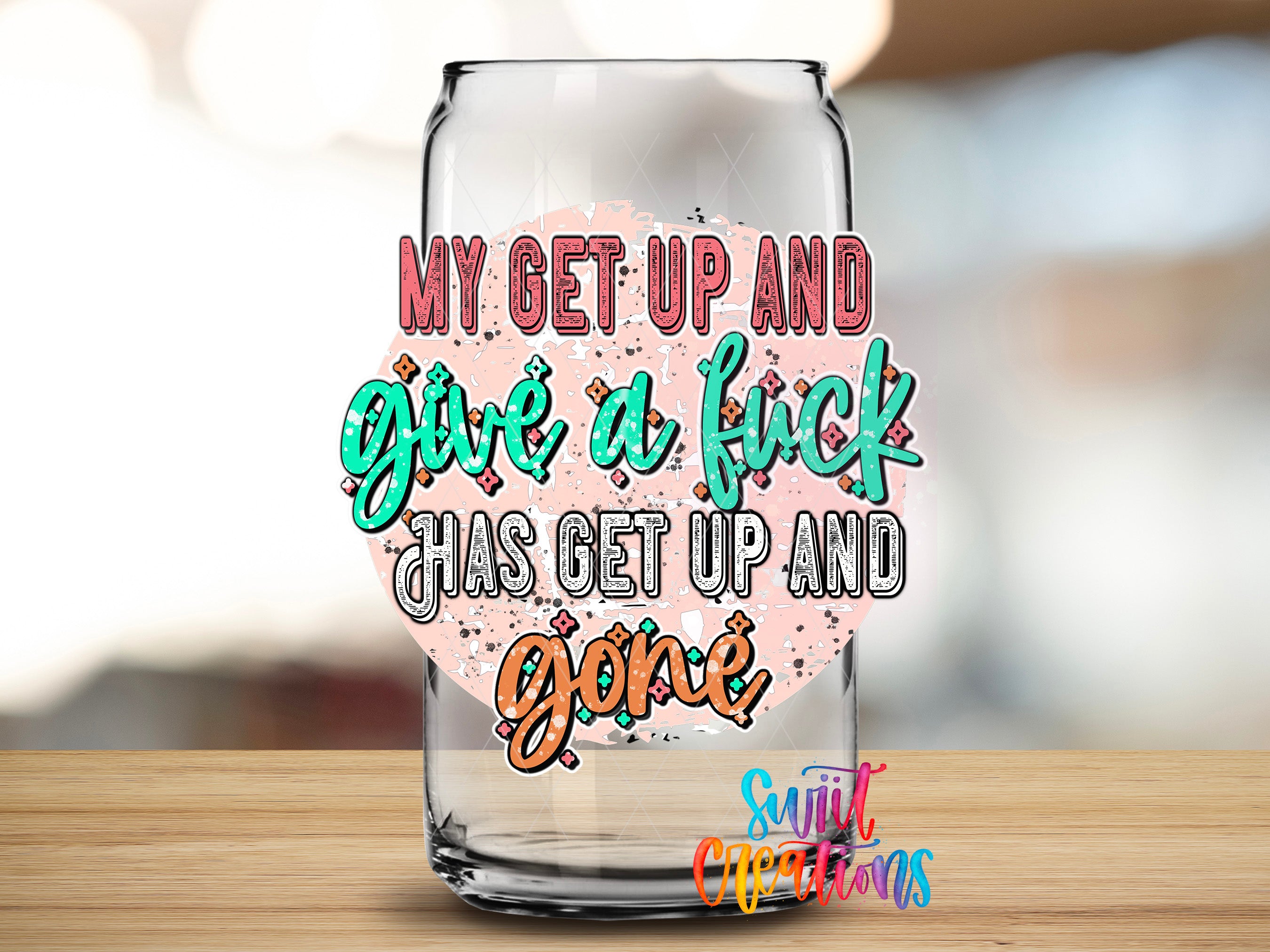 a glass can with a colorful, graffiti-style text on it, which reads "My get up and give a fuck has get up and gone".