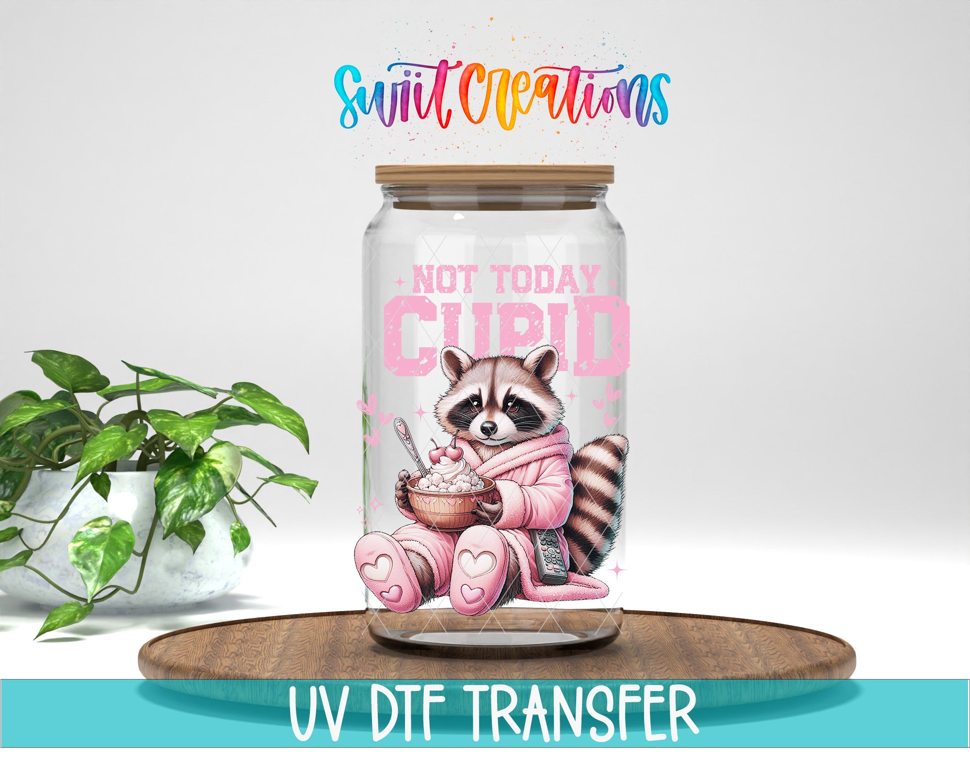 A glass jar with a raccoon wearing a pink outfit and holding a bowl of food, accompanied by the text "NOT TODAY CURI" and "CURI" in pink. The jar is placed on a wooden surface, and there is a potted plant in the background.