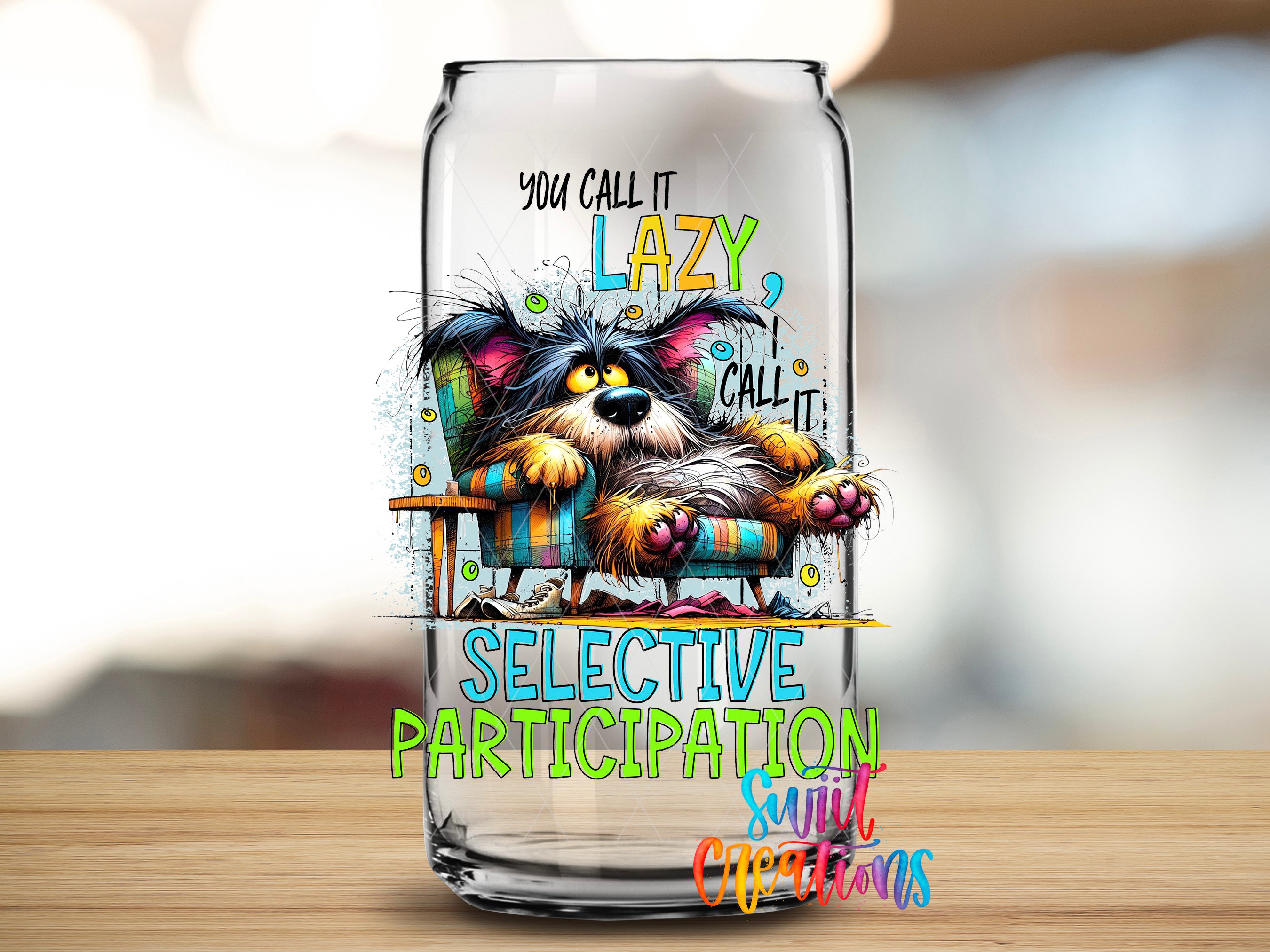 A glass can with a colorful illustration of a dog sitting in a chair, accompanied by text that reads "You call it Lazy, call it Selective Participation, smirk, Christmas".