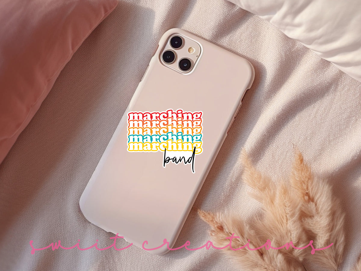 a phone case with a sticker on it sitting on a bed
