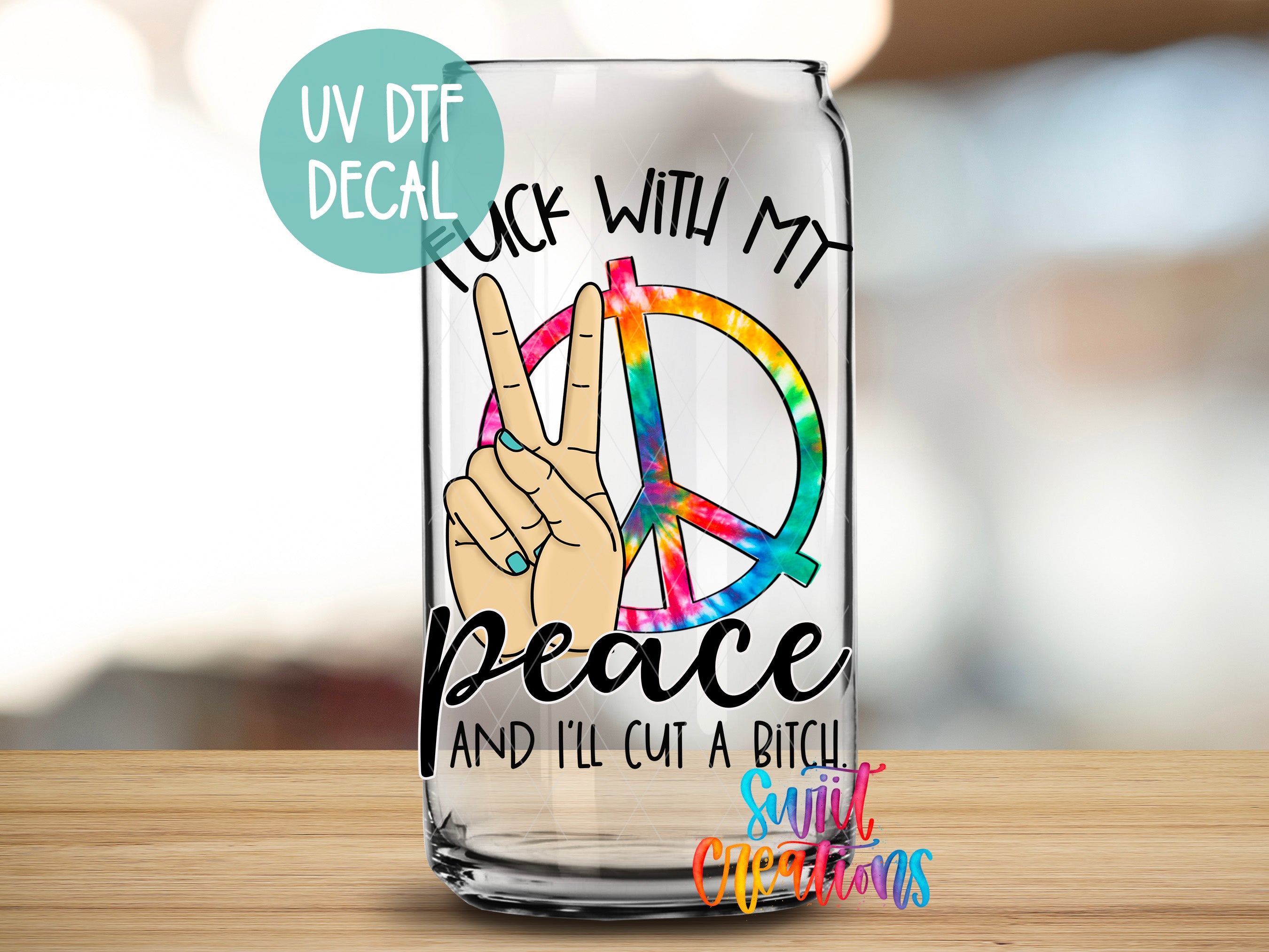 A transparent glass can with a peace sign and text that says "FUCK WITH MY PEACE AND I'LL CUT A BITCH" printed on it.