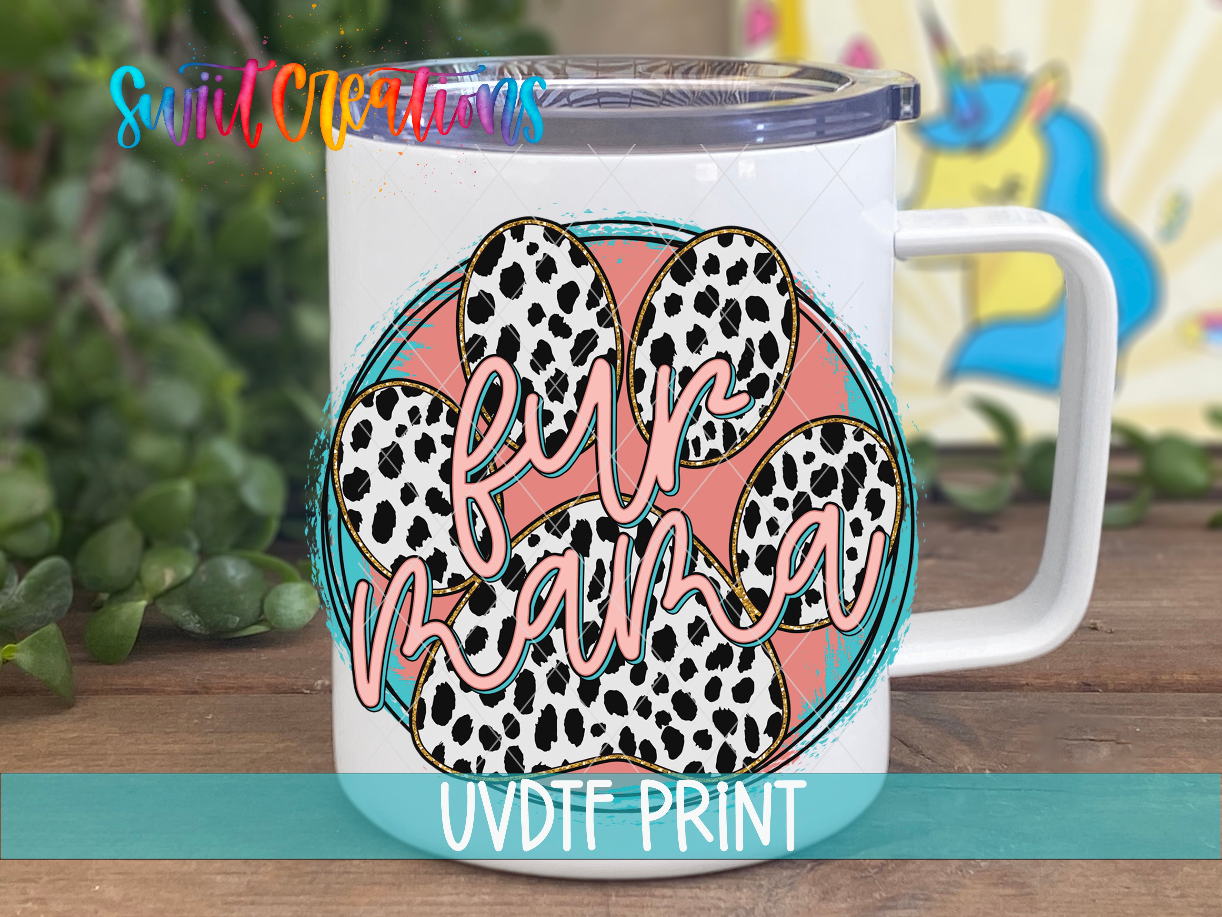 A white mug with a colorful design featuring a paw print and the text "Fur Mama" printed on it.