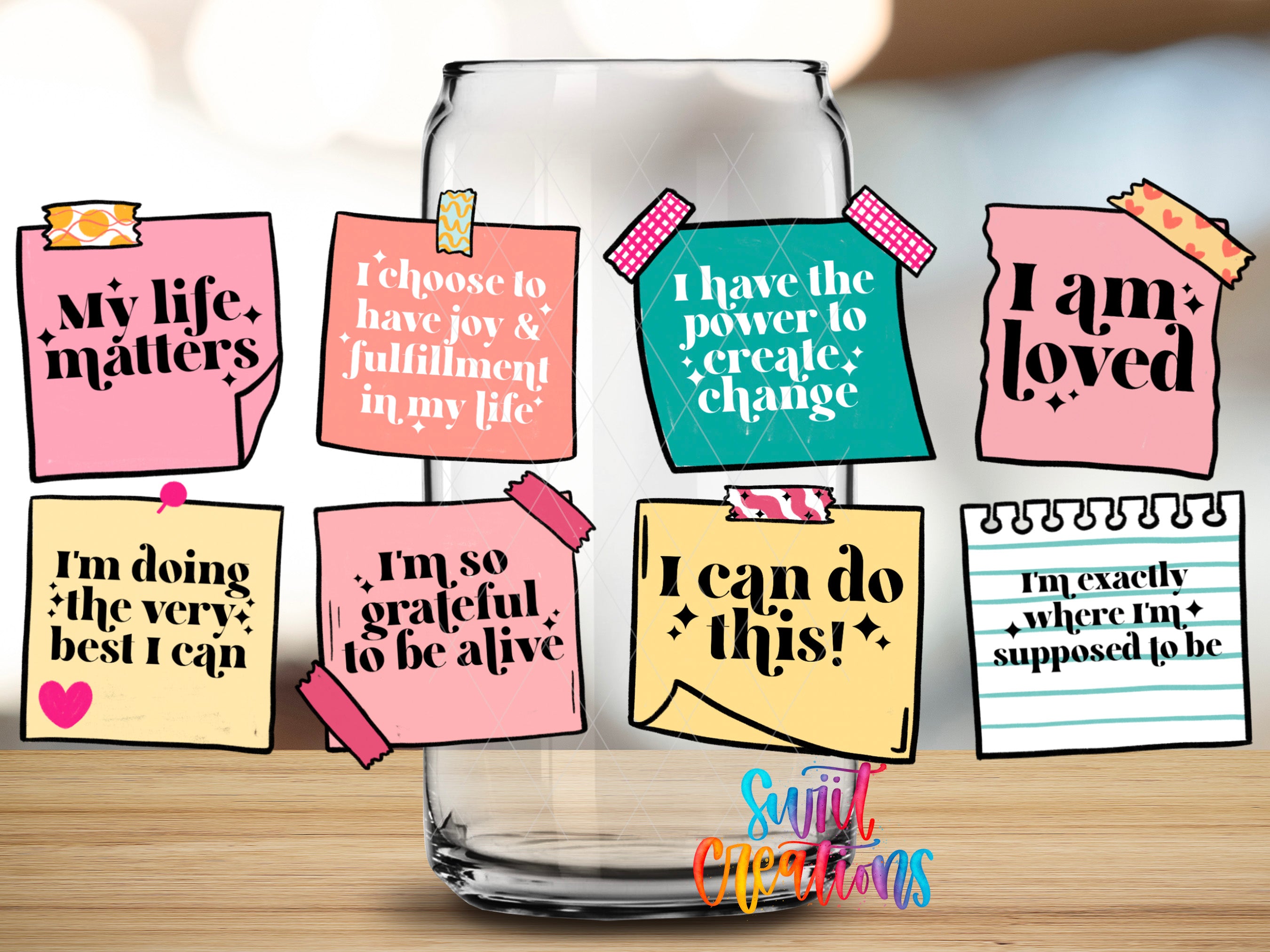 a collection of colorful sticky notes with motivational messages, placed on a table in front of a glass jar.