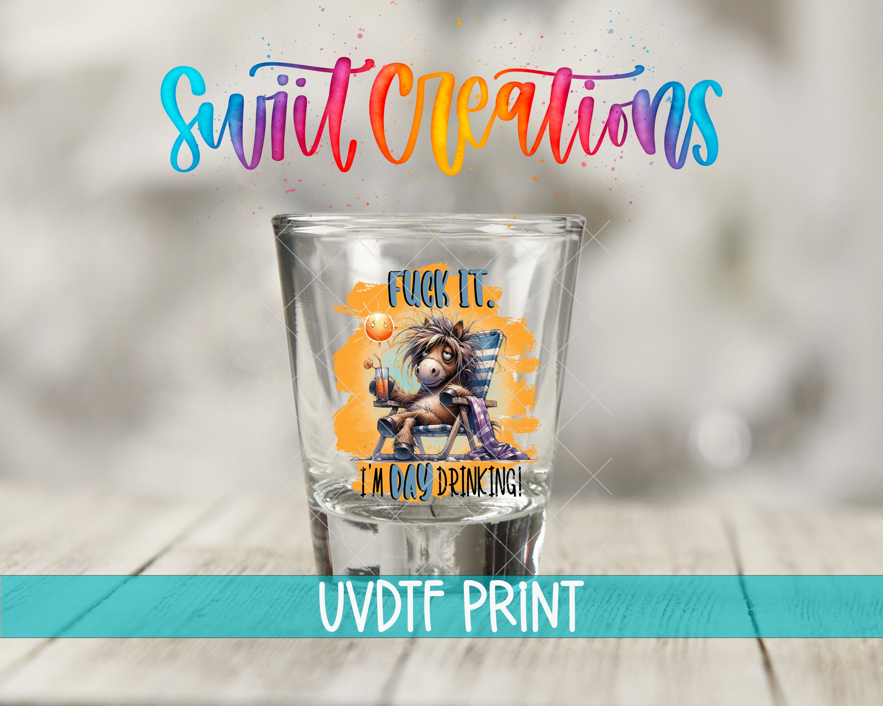 a shot glass with a colorful, whimsical design and text on it.