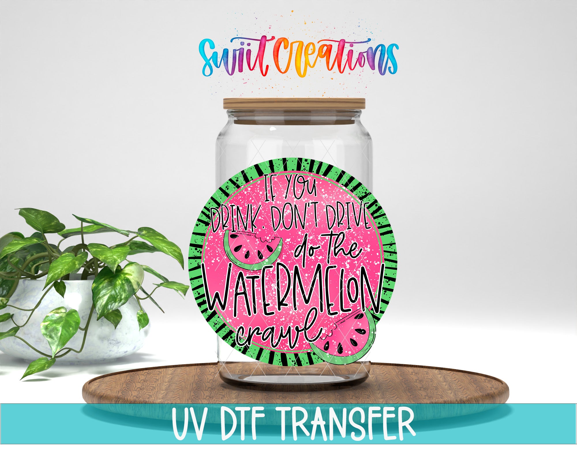 a glass jar with a label that says "If you drink don't drive, do the watermelon crawl" and is placed on a wooden surface. There is also a plant in the background.