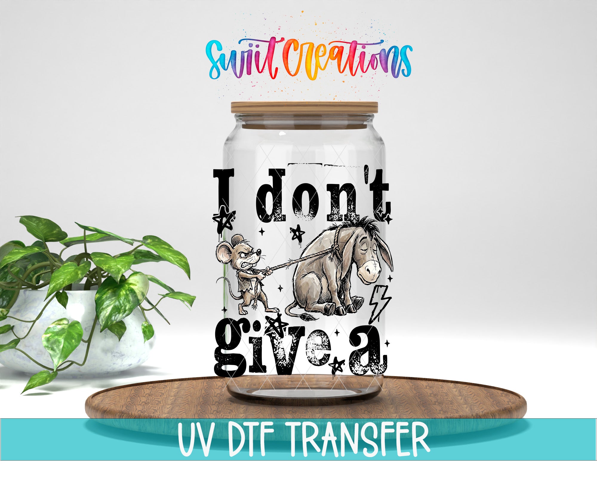 A glass jar with a cartoon image of Eeyore, a famous character from Winnie the Pooh, and the text "I don't give a" printed on it. The jar is placed on a wooden surface, and there is a potted plant in the background.