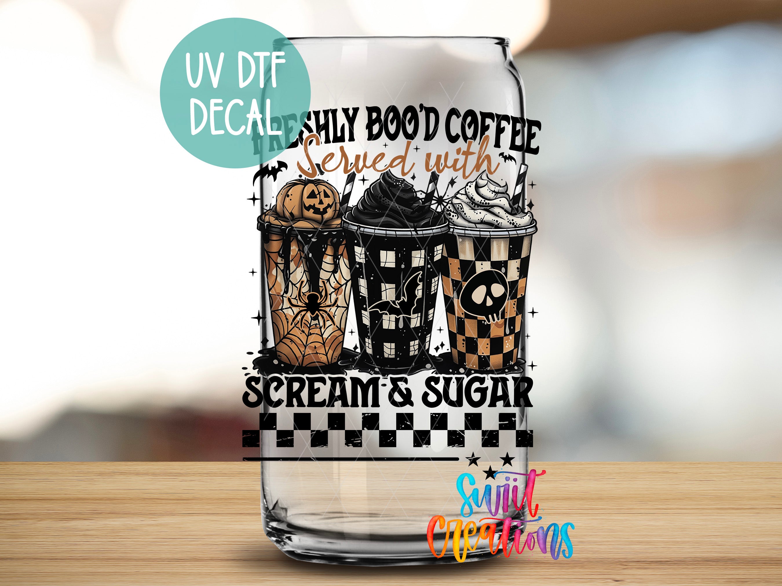 A glass can with a Halloween-themed design featuring a pumpkin, spider, and a cup of coffee with whipped cream and a skull.