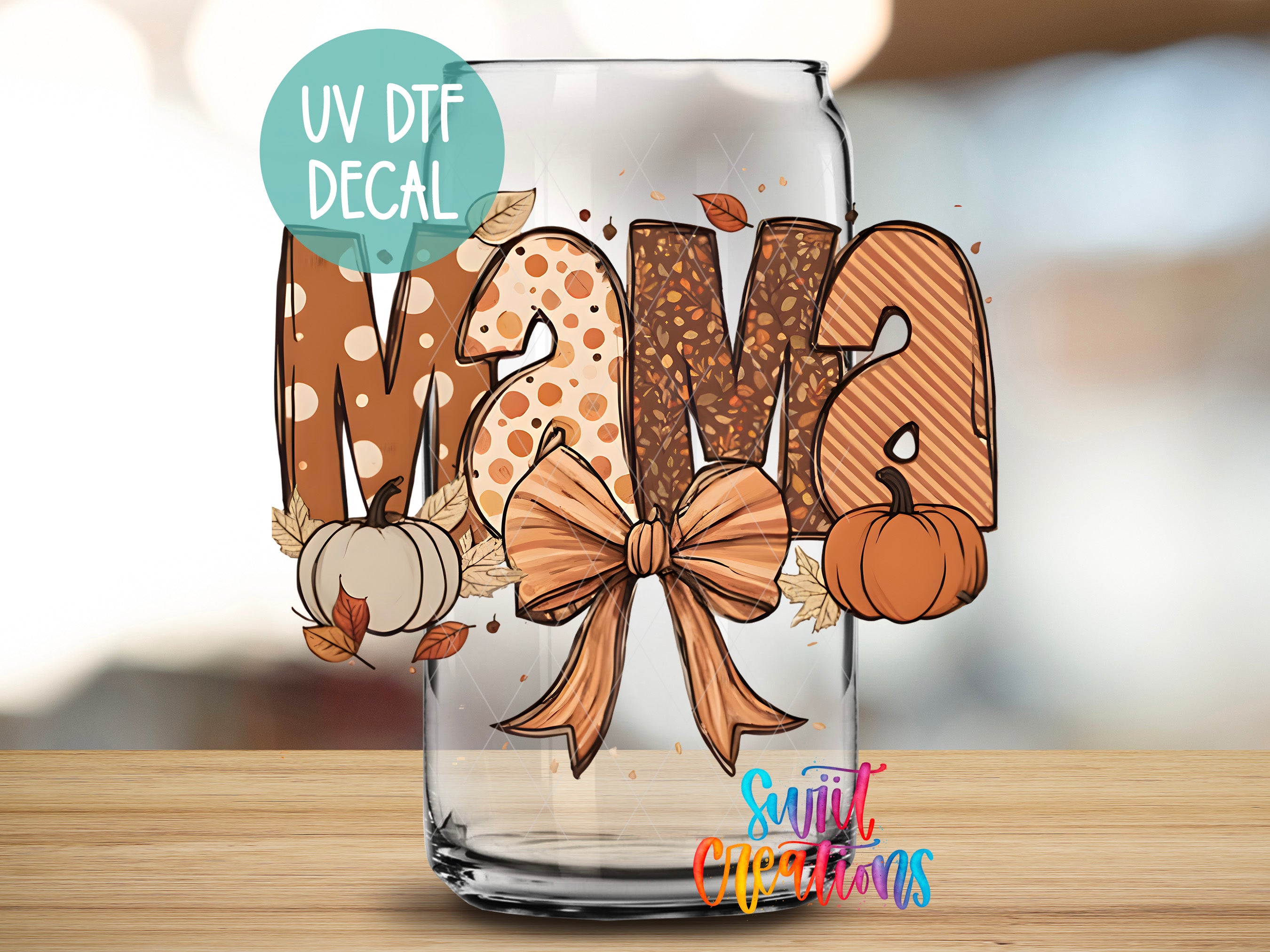 a glass with a bow on it sitting on a table