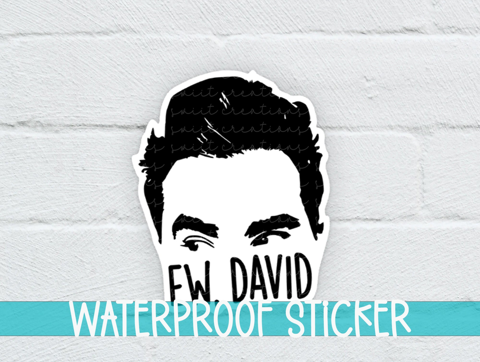 a sticker of a man's face on a white brick wall