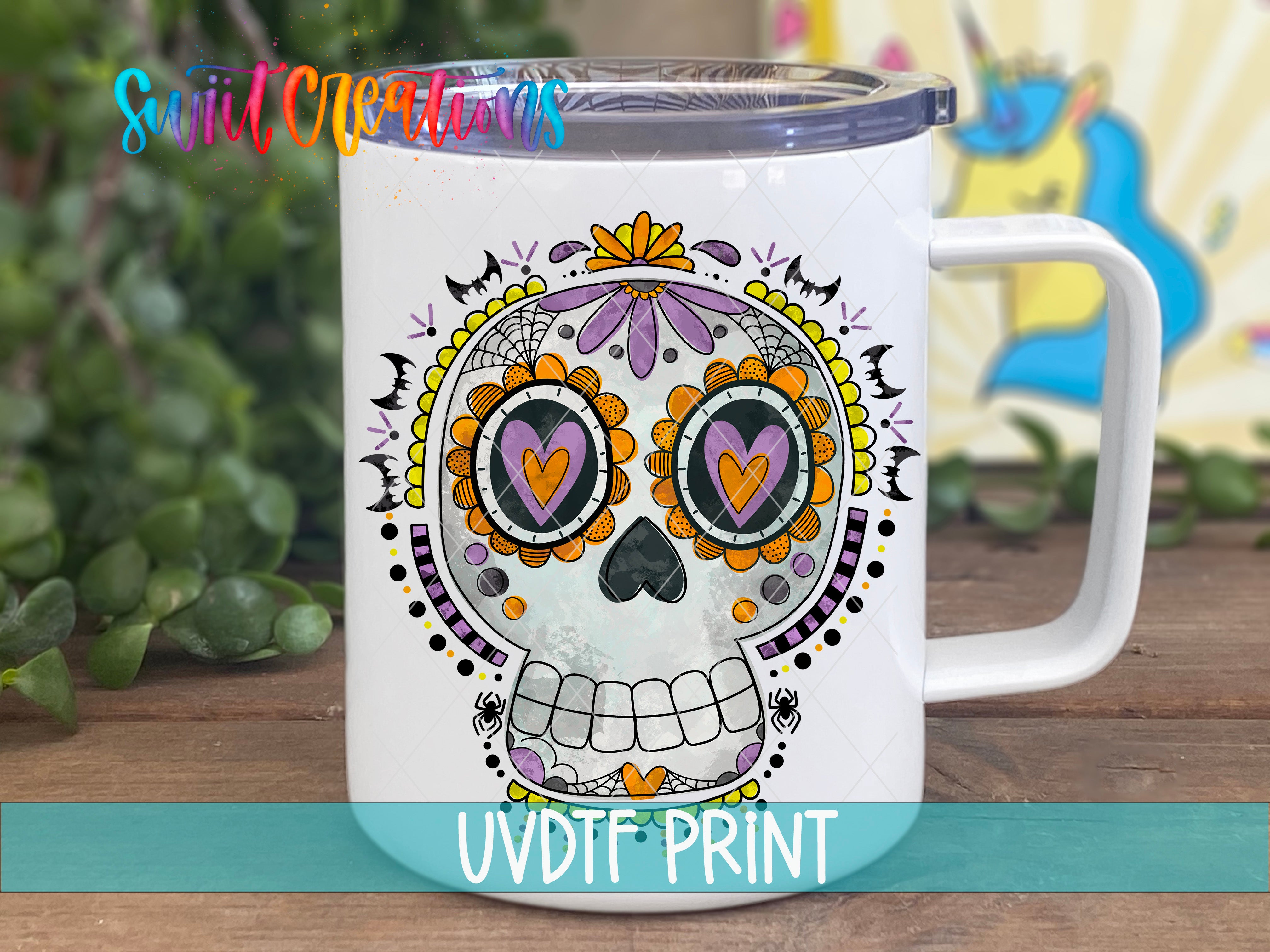 A white ceramic mug with a colorful, intricate design of a skull and floral patterns.