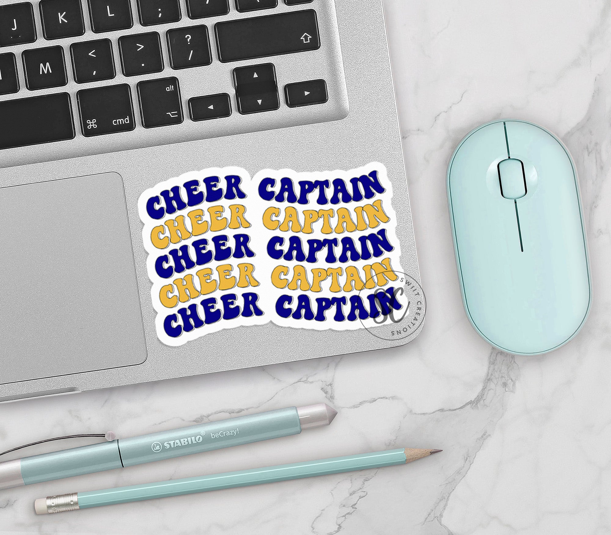 a laptop computer sitting on top of a white table