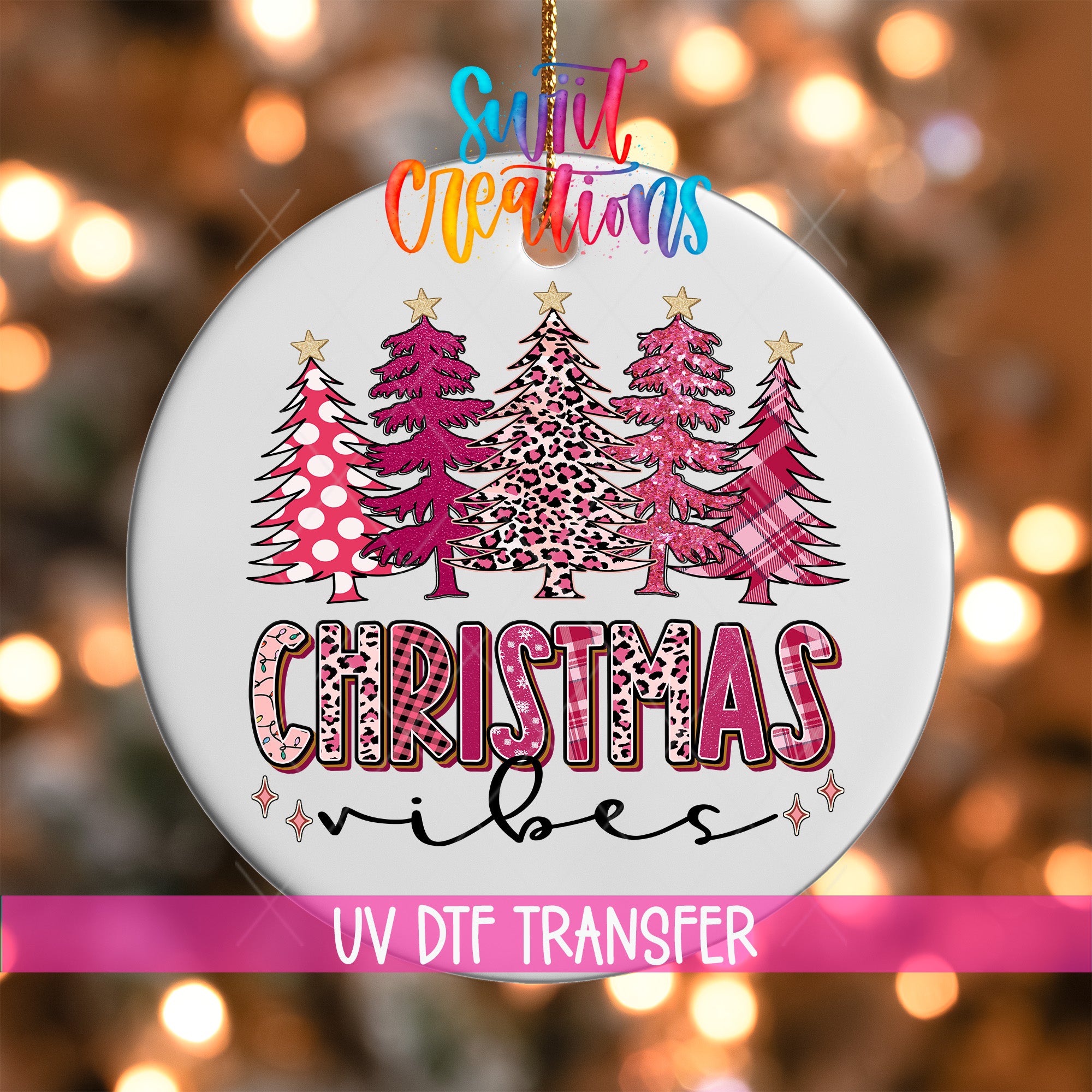 A Christmas ornament with a design of three stylized Christmas trees in pink and leopard print, along with the text "Christmas vibes" in a colorful, decorative font.