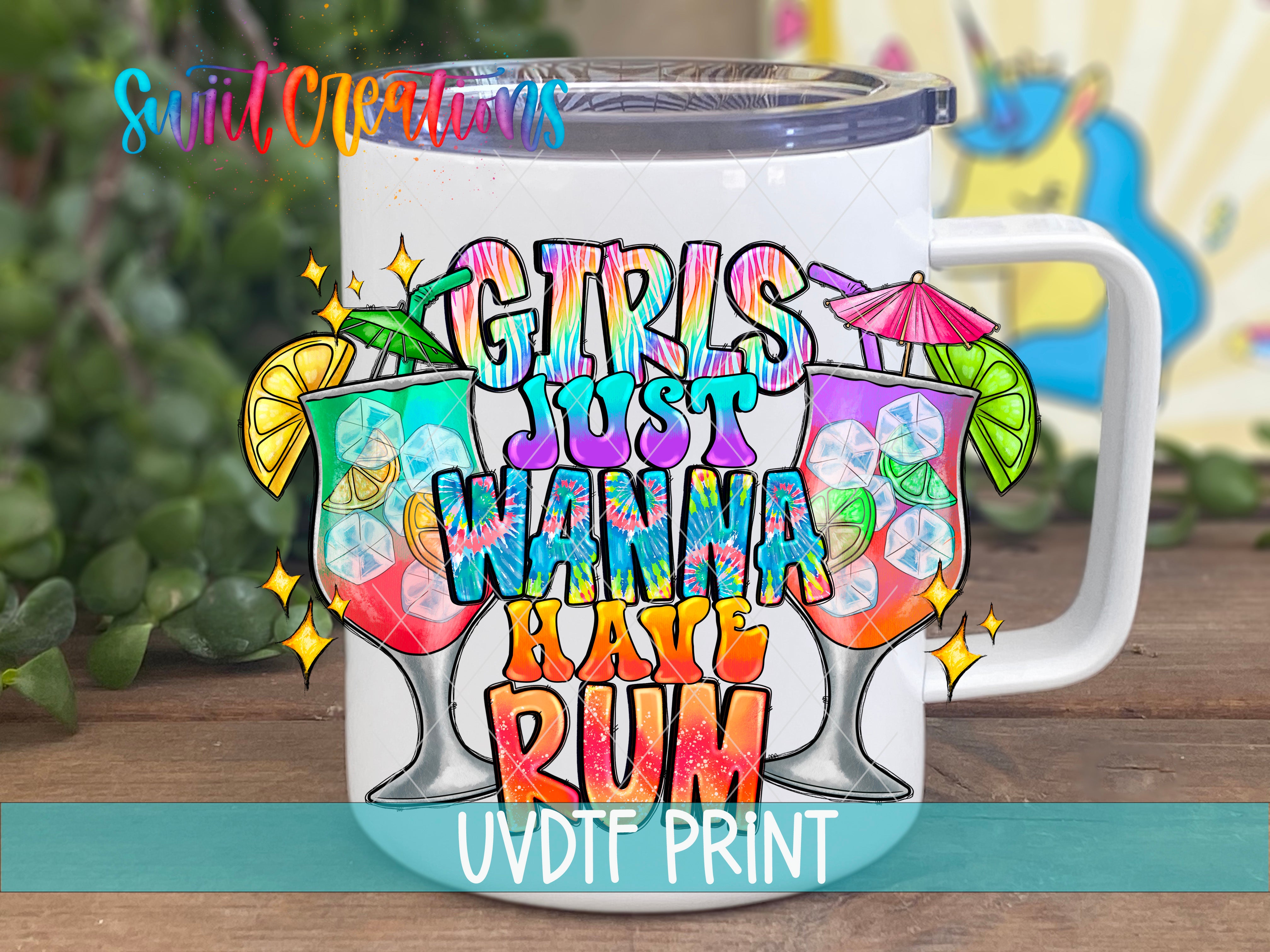 A colorful mug with a printed design that says "GIRLS JUST WANNA HAVE RUM" along with illustrations of colorful drinks and a unicorn.