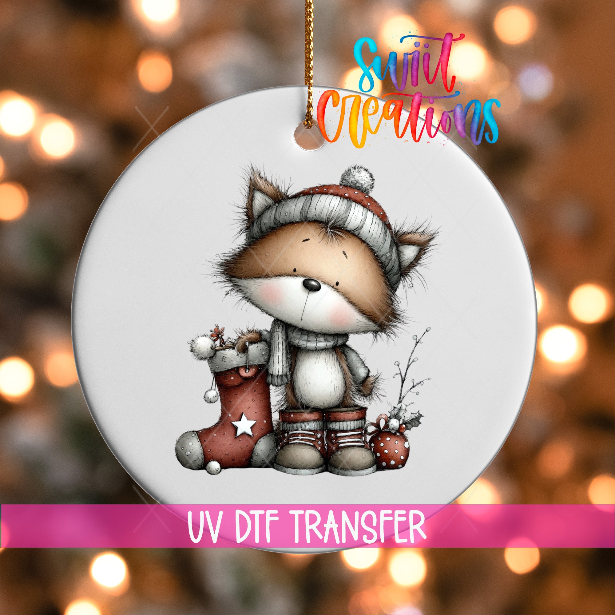 A white ornament with a cartoon illustration of a cat wearing a hat and holding a stocking, set against a blurred background with Christmas lights.