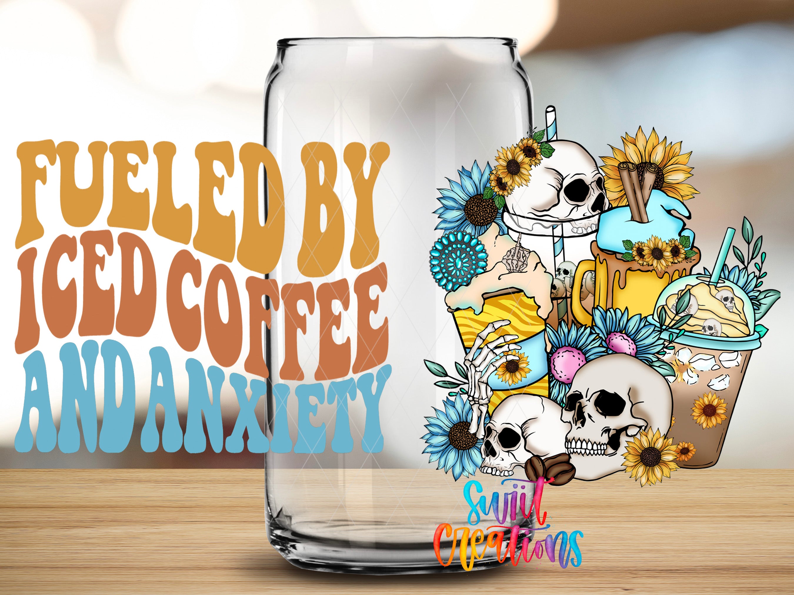 a glass can with a colorful illustration of a skull surrounded by flowers and a cup of iced coffee, along with text that reads "Fuelled by Iced Coffee and Anxiety".