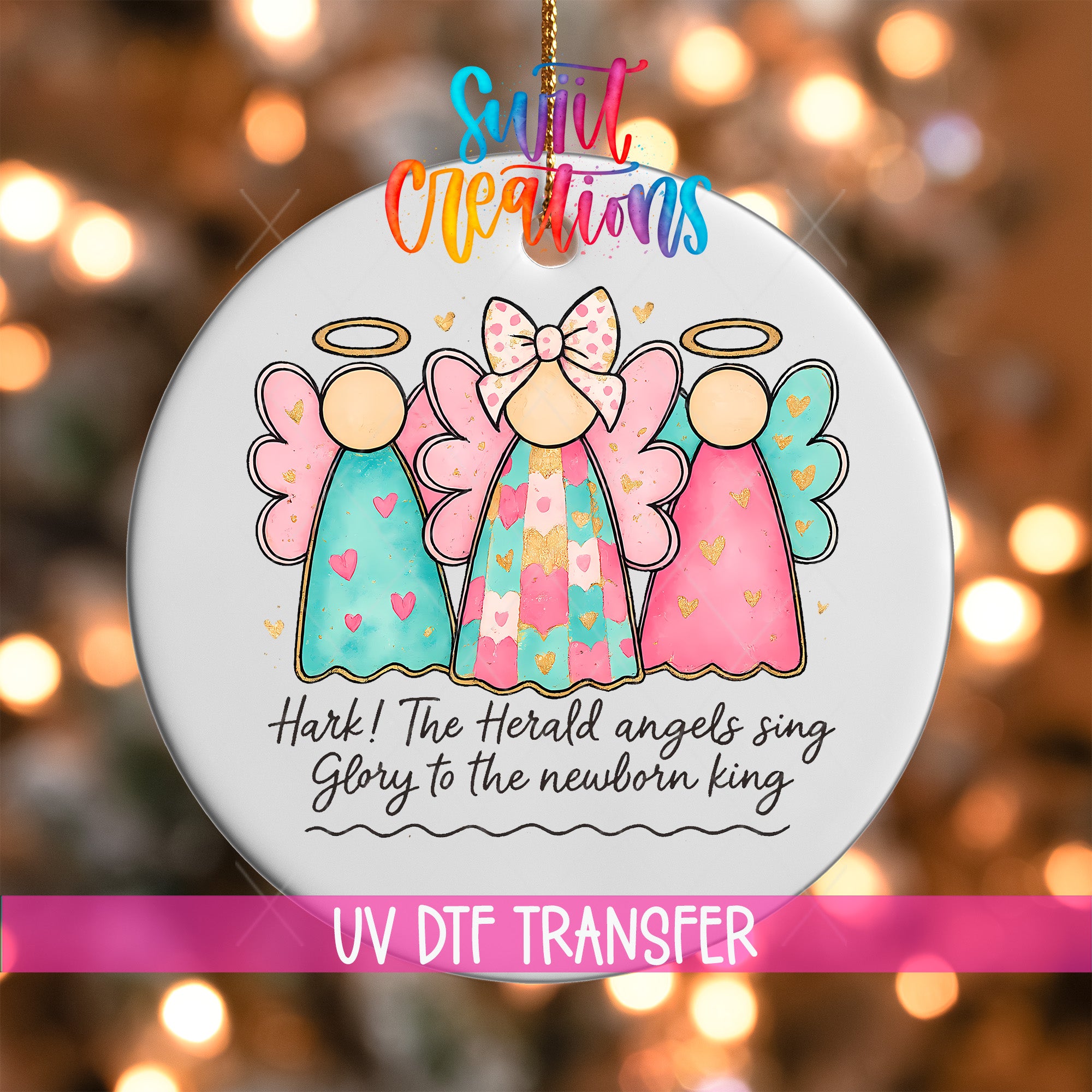 A decorative ornament featuring three colorful angel figures with haloes, accompanied by the text "Hark! The Herald angels sing glory to the newborn king" and the UV DFT Transfer logo.