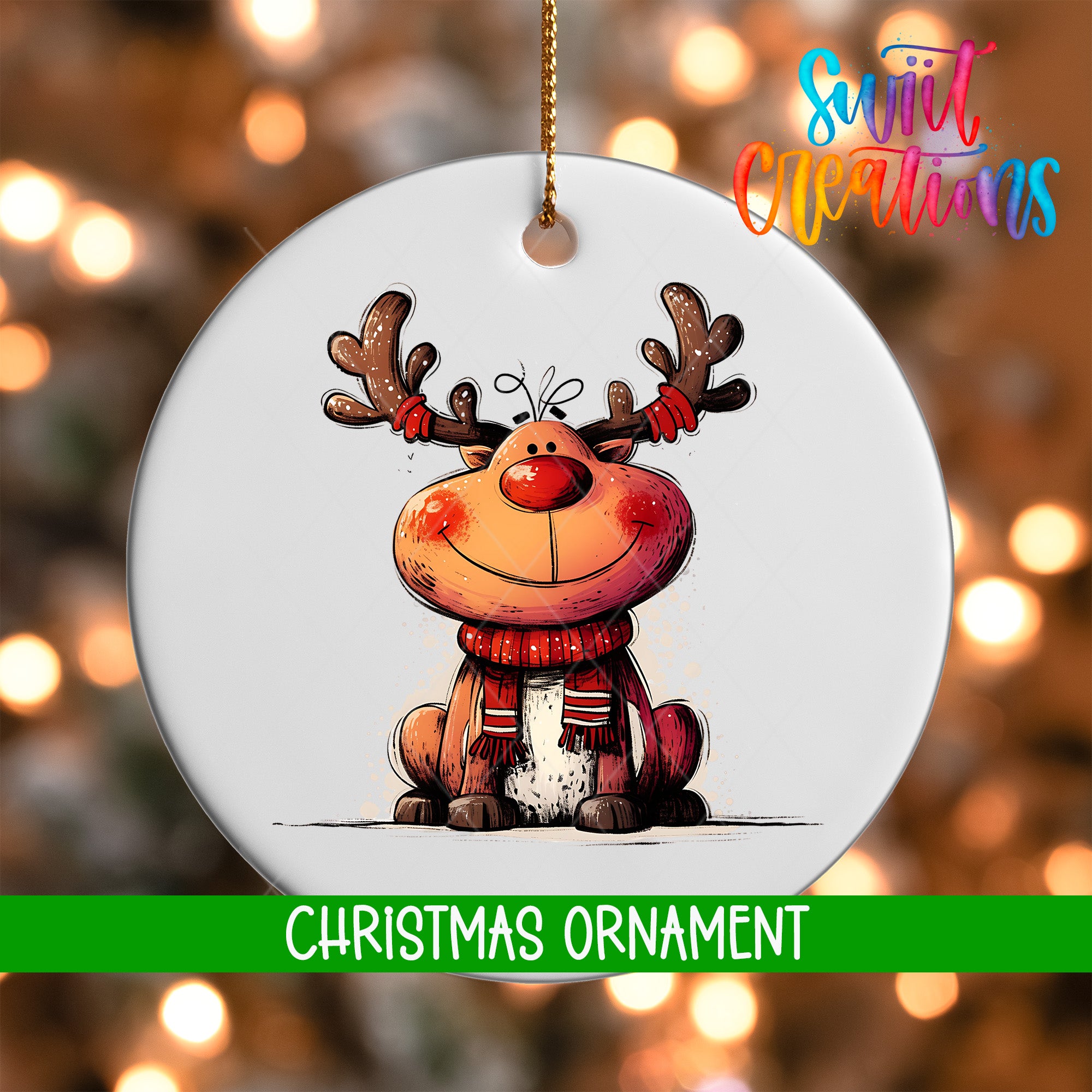 A white Christmas ornament featuring a smiling reindeer with antlers, set against a blurred background with colorful lights.