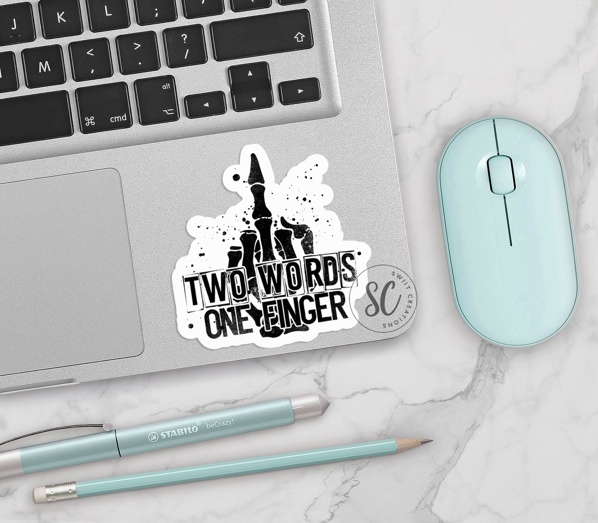 a laptop computer sitting next to a mouse and keyboard