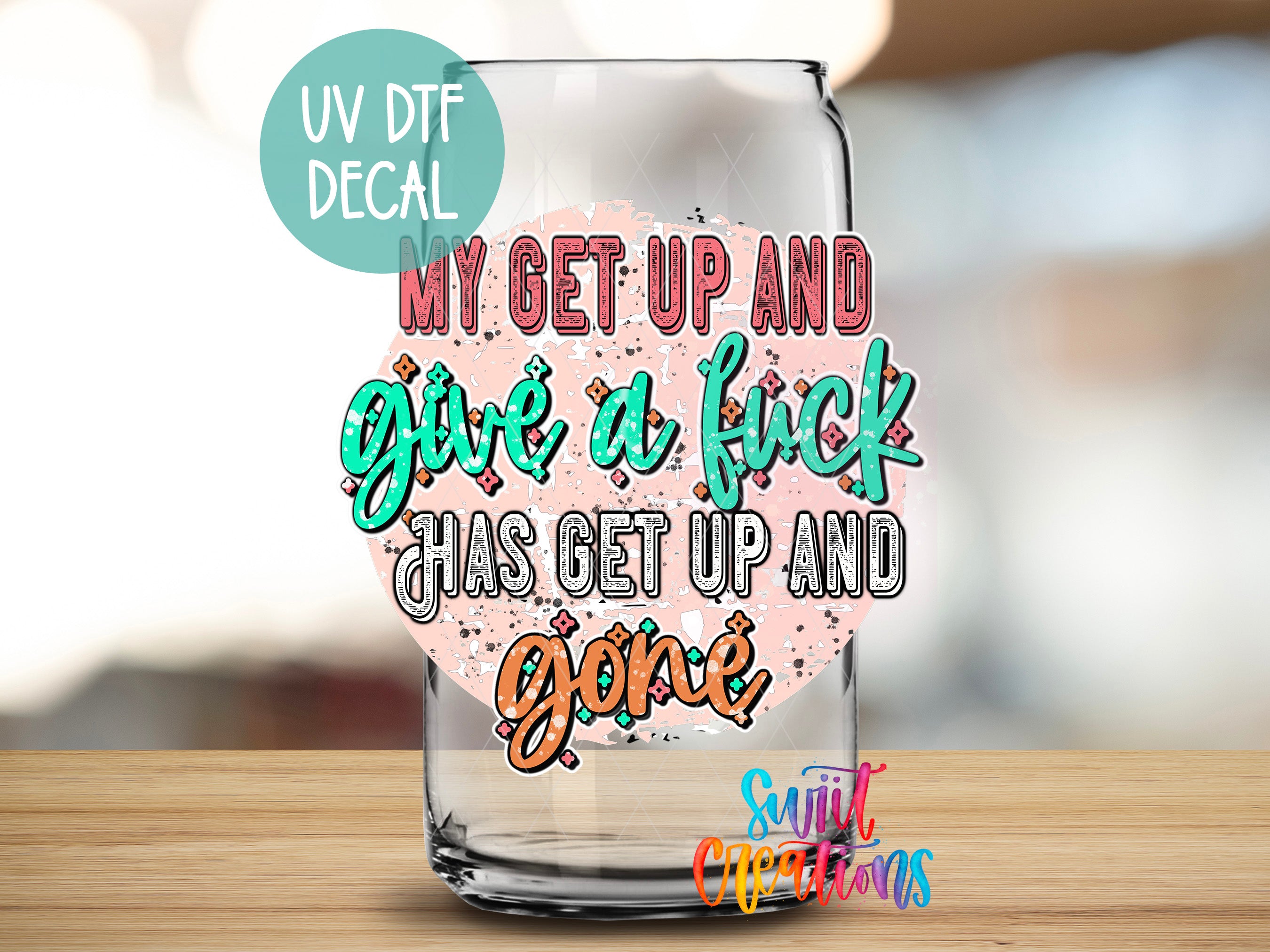 a glass with a quote on it sitting on a table