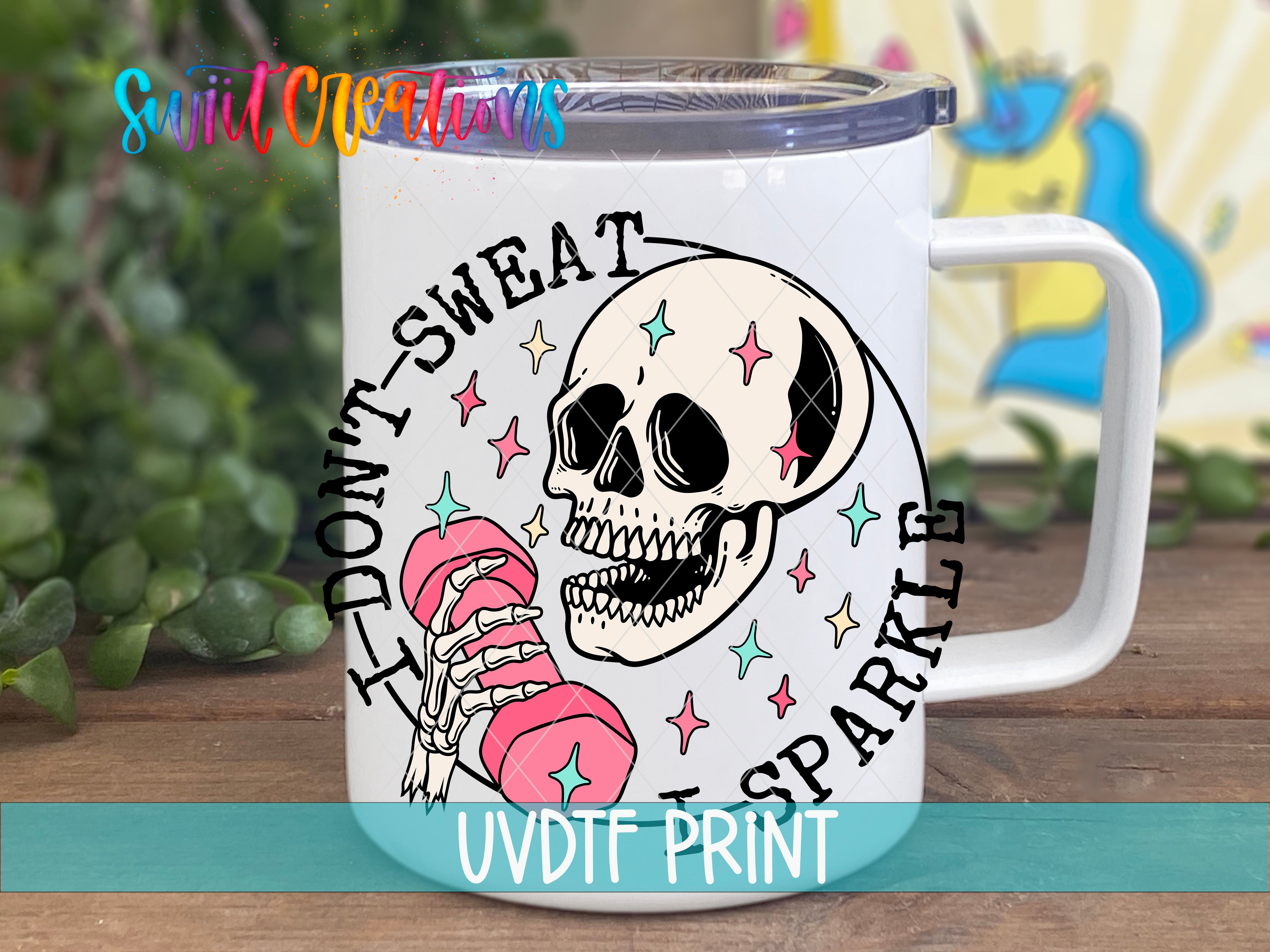 A white mug with a skull design and text printed on it.