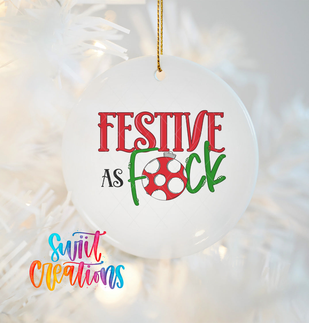A white ornament with the text "FESTIVE AS FOCK" and a red and white polka dot design hanging from a string.
