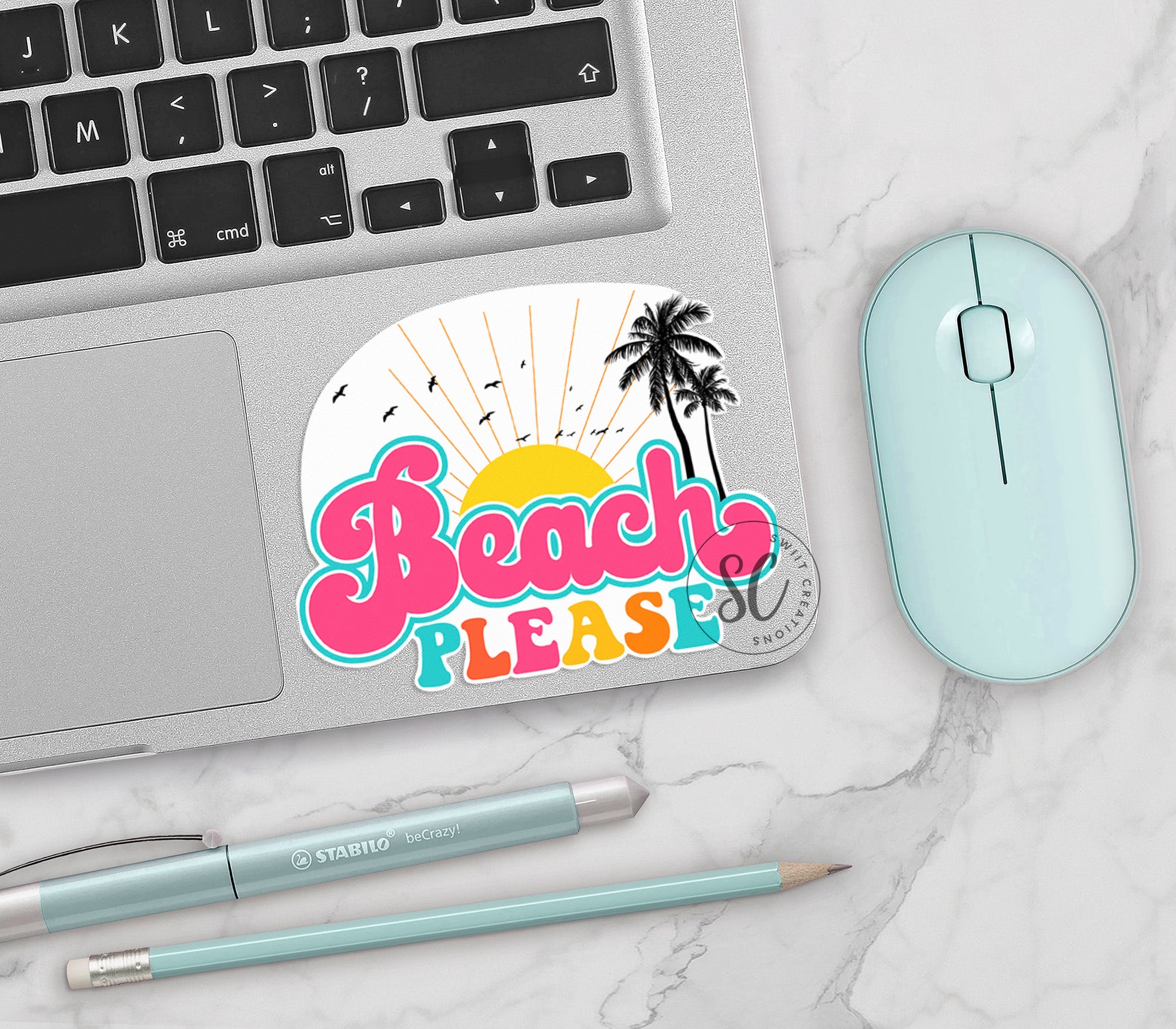 a laptop computer sitting on top of a white table