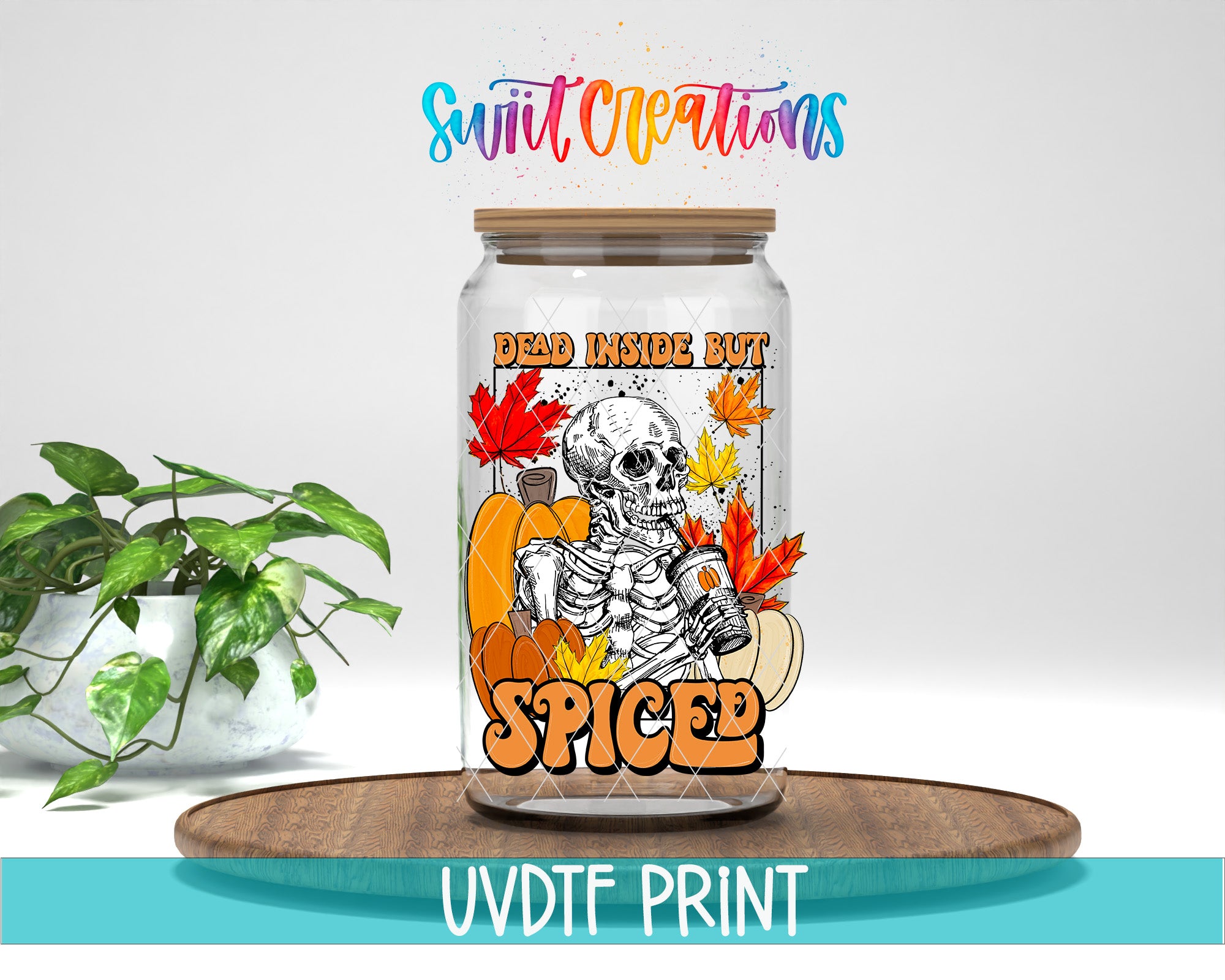a glass jar with a label that includes a skeleton, pumpkins, and leaves, along with the text "Dead Inside But SPICE". The jar is placed on a wooden surface, and there is a potted plant in the background.