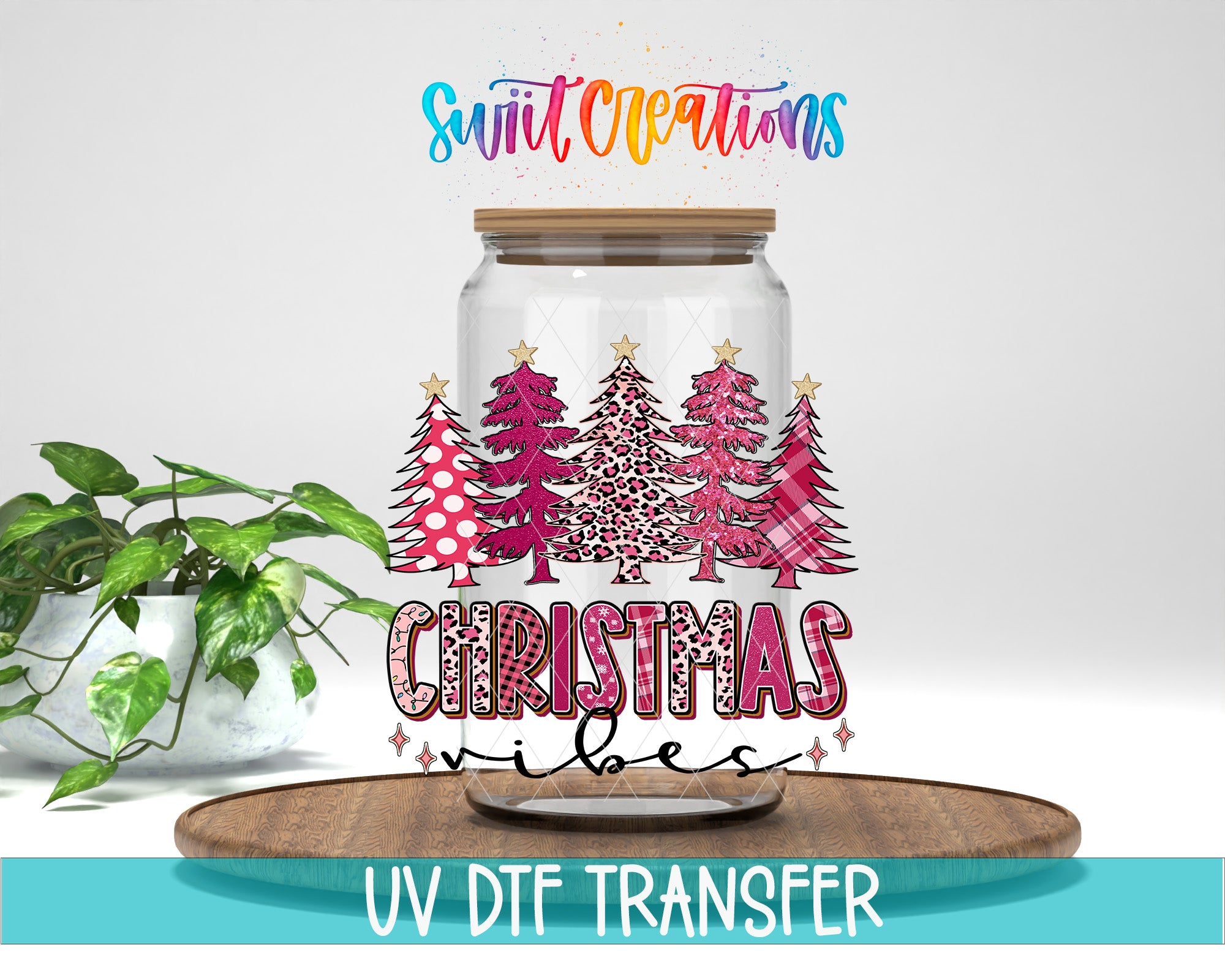 A glass jar with a Christmas tree design and the text "Christmas vibes" printed on it, placed on a wooden surface.