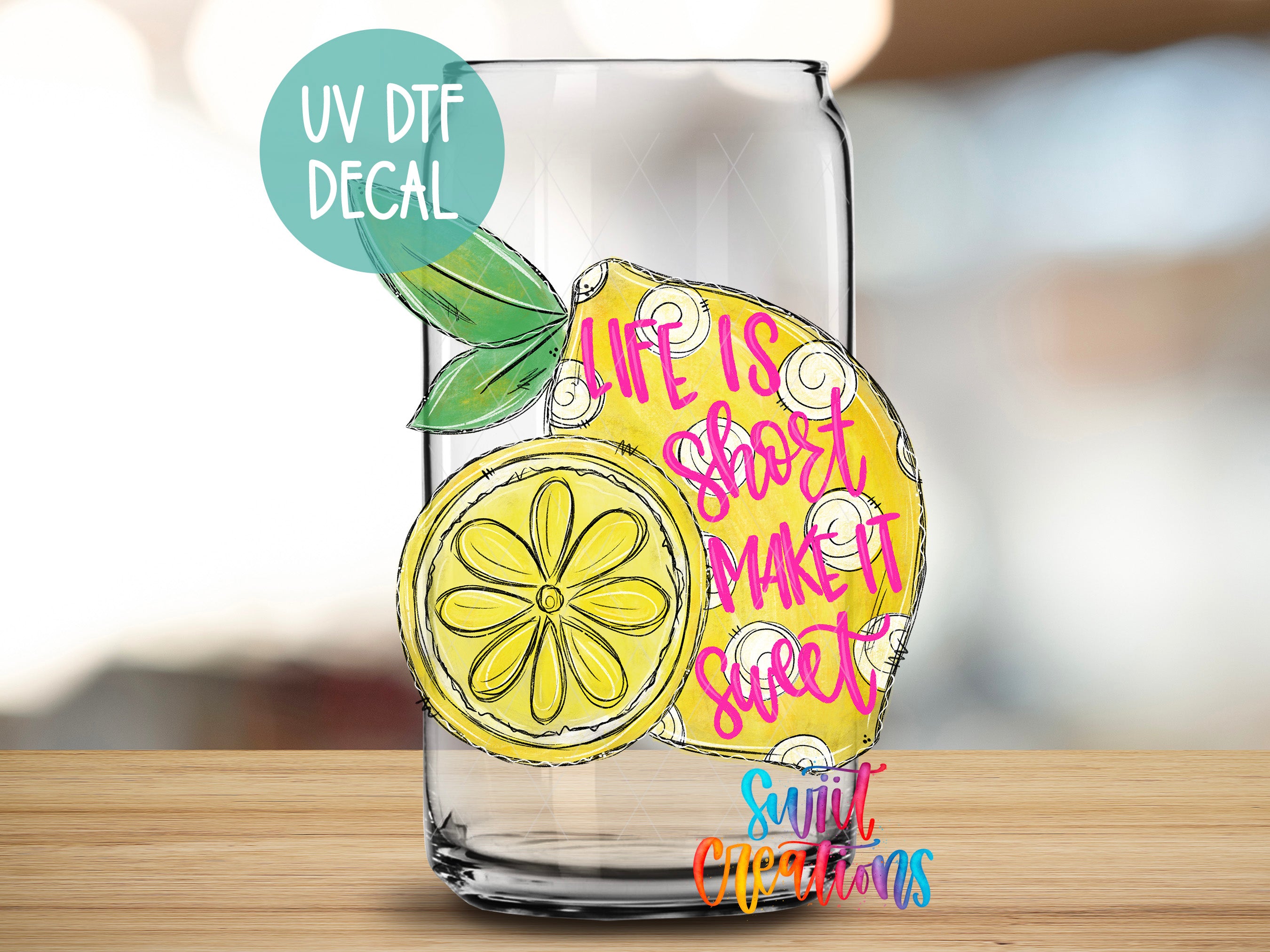 a glass with a drawing of a lemon on it