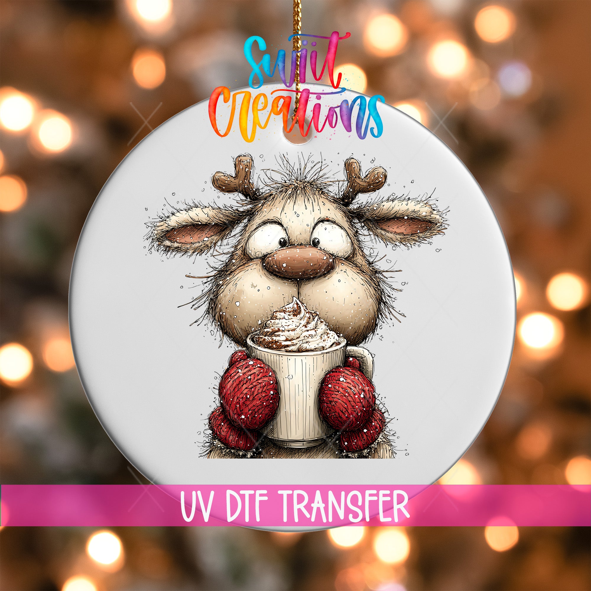 A white ornament with a cartoon reindeer holding a cup of hot chocolate, surrounded by colorful lights.