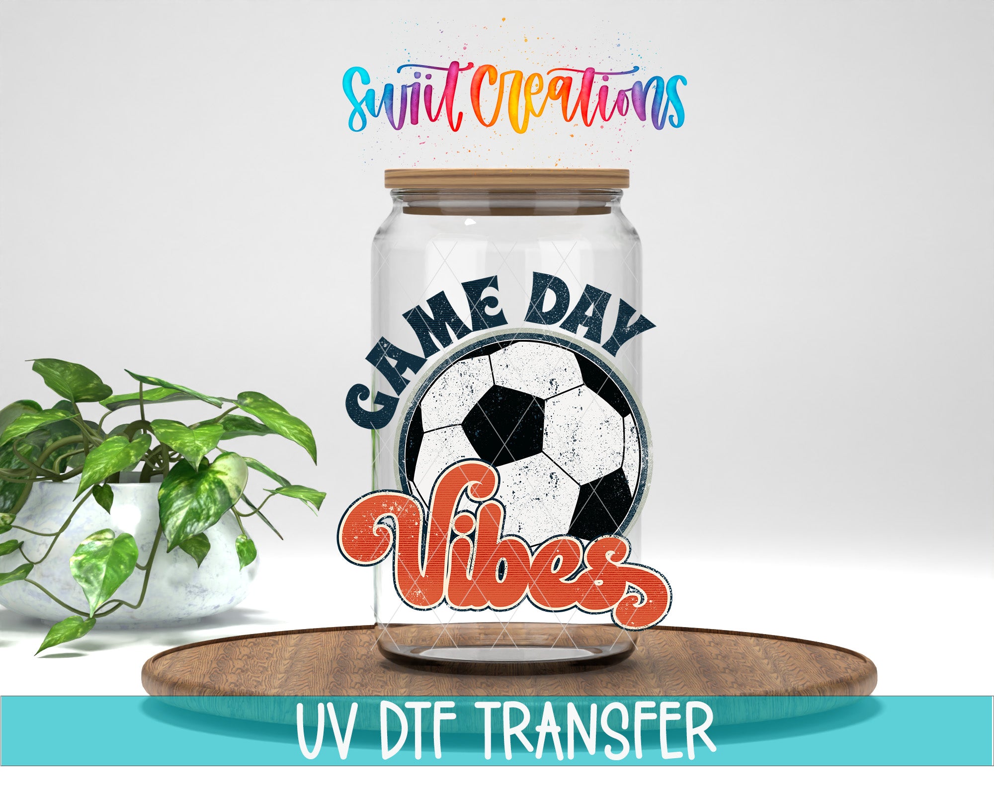 a glass jar with a soccer ball design and the text "GAME DAY VIBES" printed on it, placed on a wooden surface.