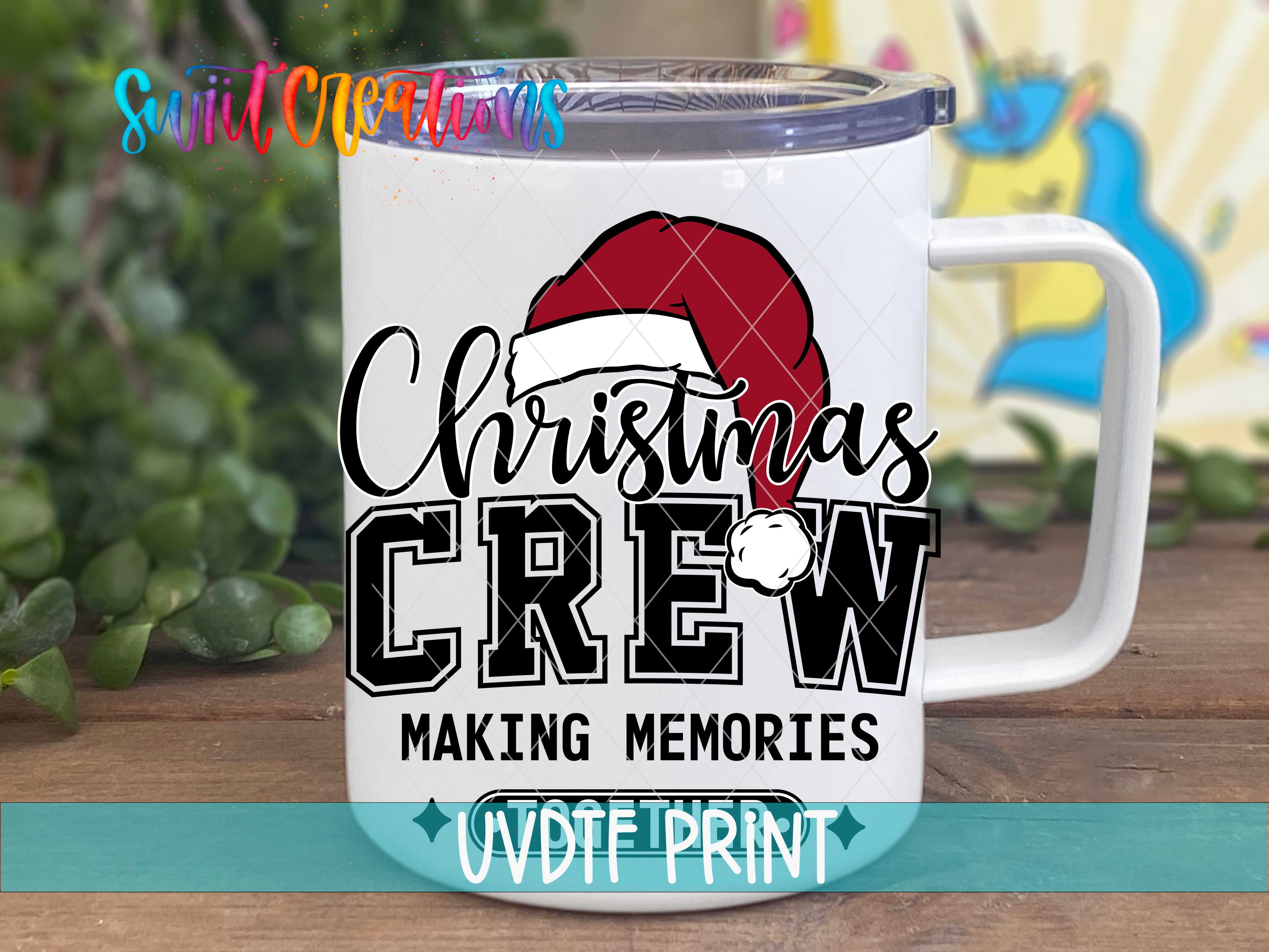 A white mug with a red Santa hat and the text "Christmas Crew" printed on it, along with the text "Making memories" below.