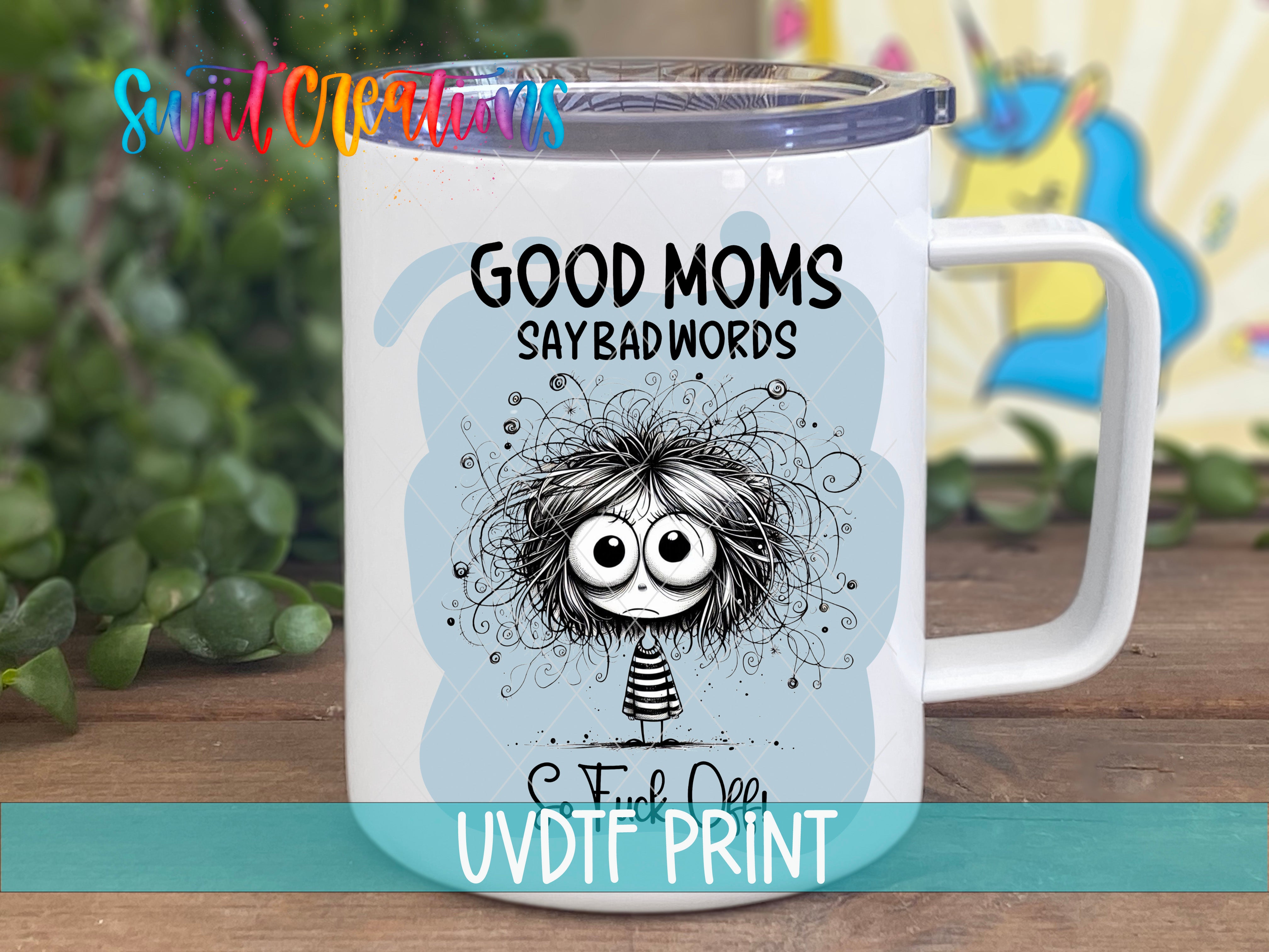 A white mug with a cartoon character and text printed on it, placed on a wooden surface.