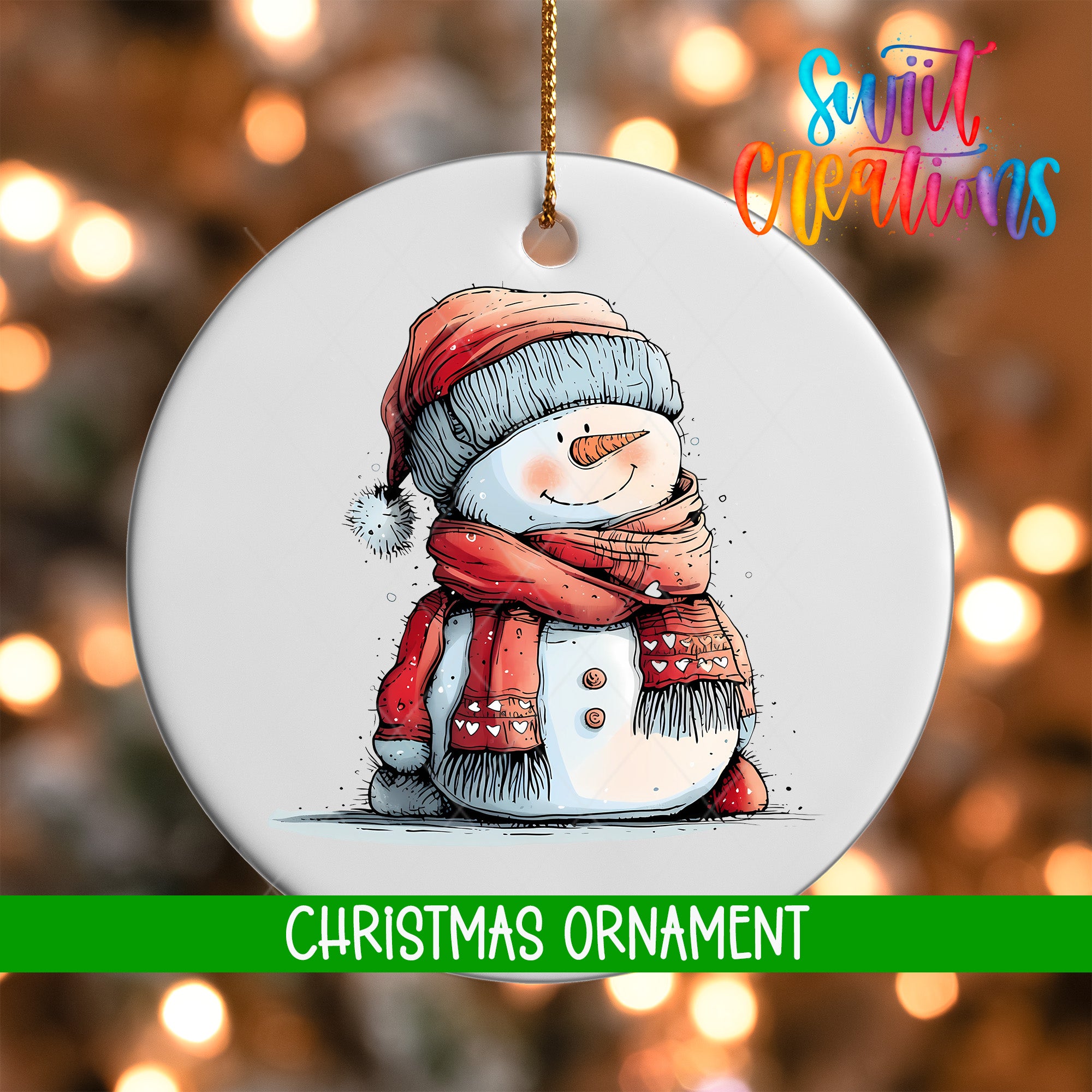 A white Christmas ornament featuring a snowman wearing a red scarf and hat, with a green ribbon around its neck.