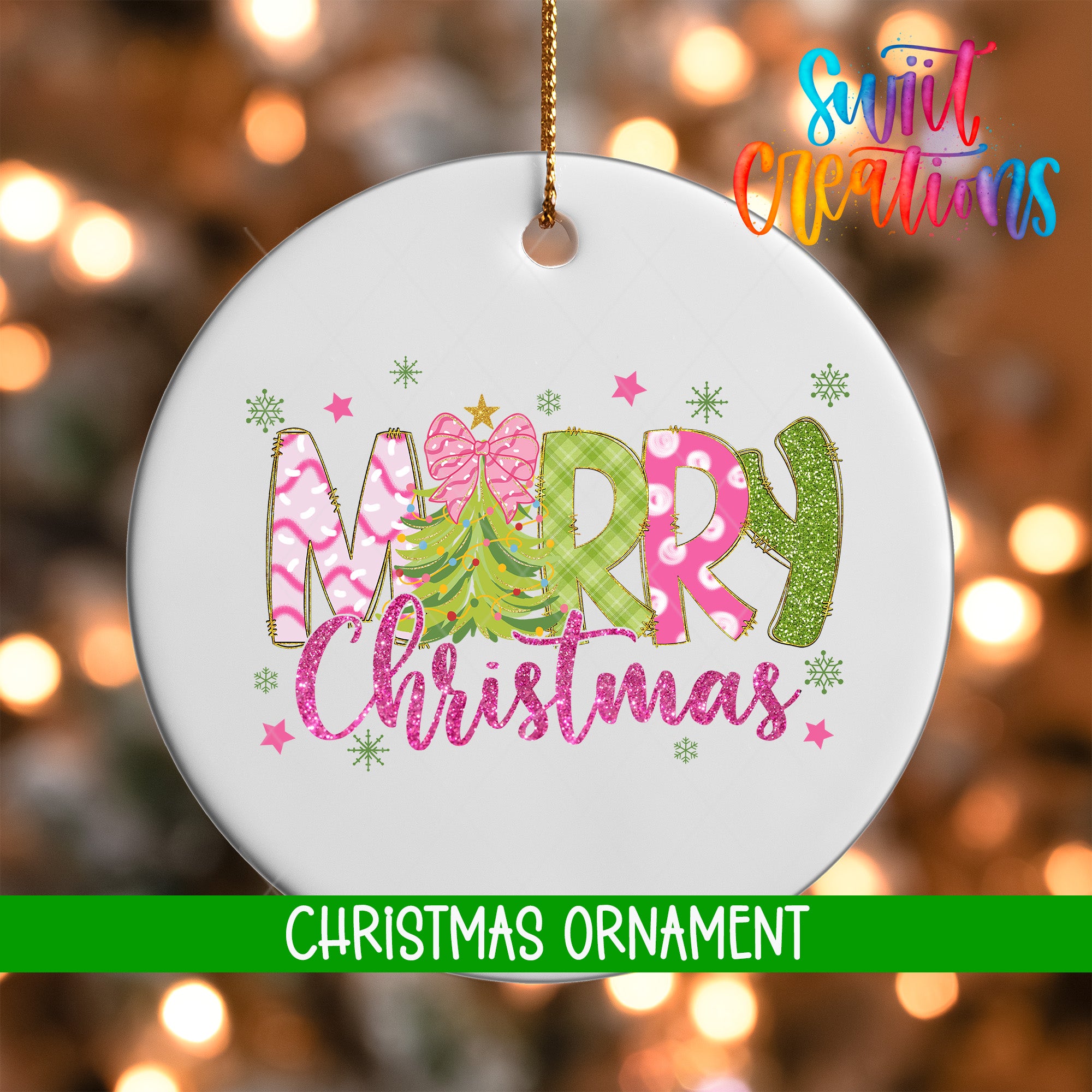 A white Christmas ornament with the text "Merry Christmas" in pink and green colors, surrounded by snowflakes and a tree design.