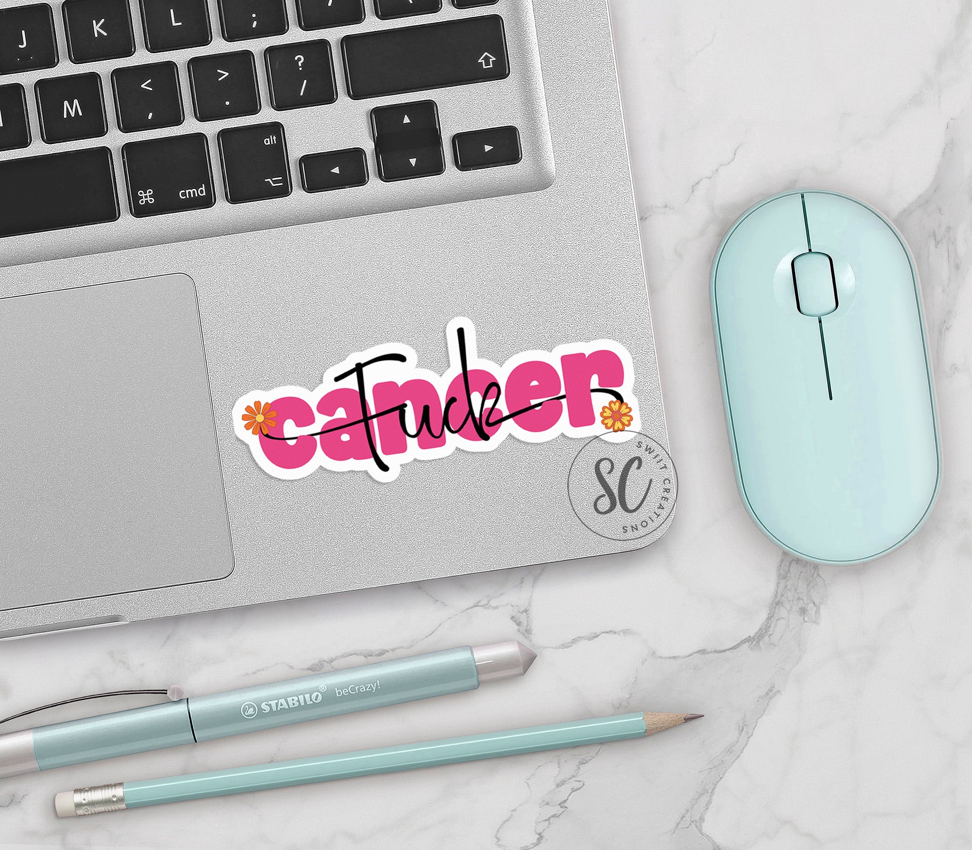 a laptop computer sitting next to a mouse and keyboard