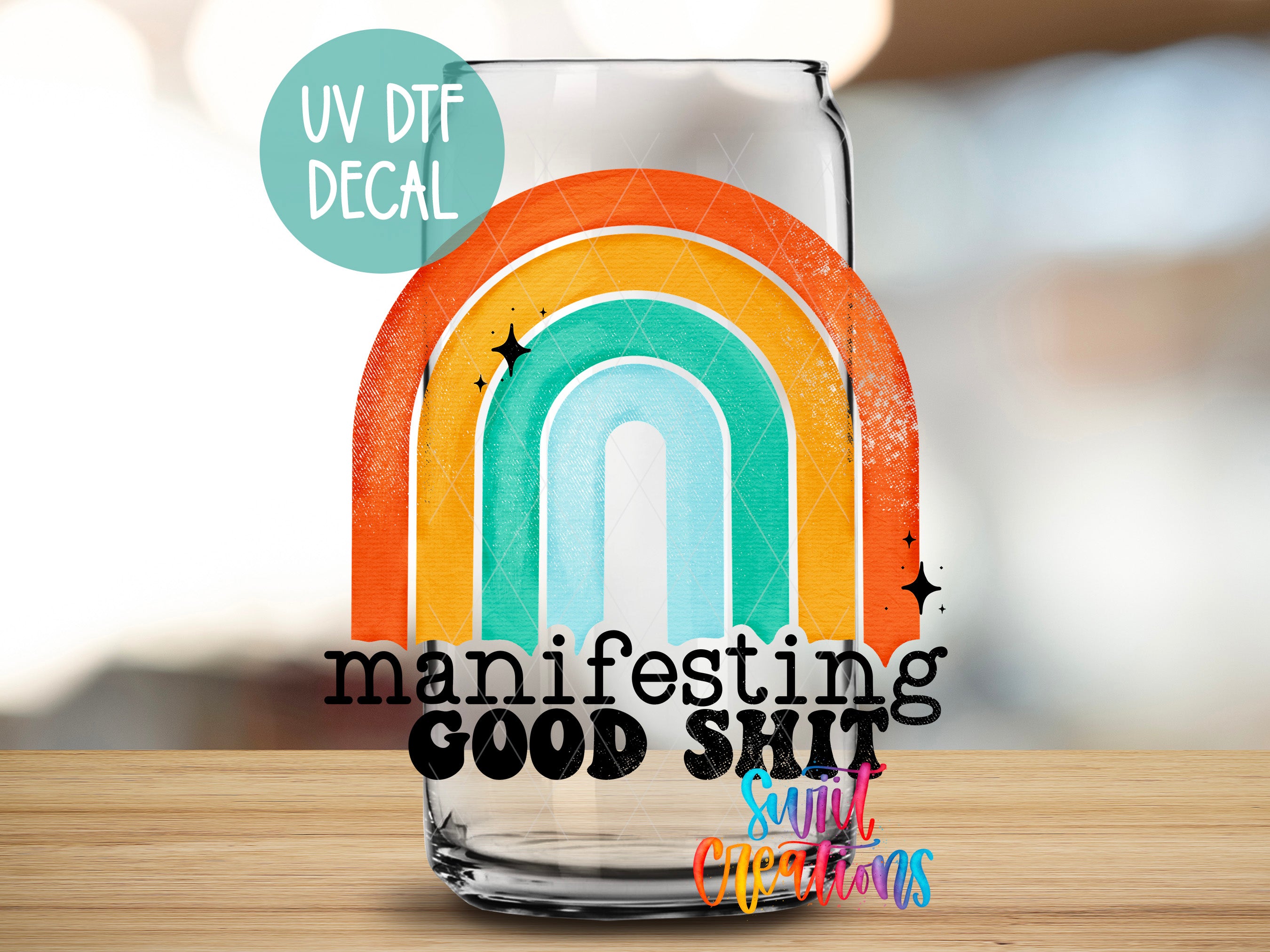 a glass with a rainbow painted on it