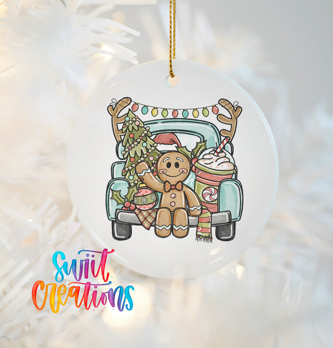 A white ornament with a gingerbread man and Christmas decorations hanging from a string.