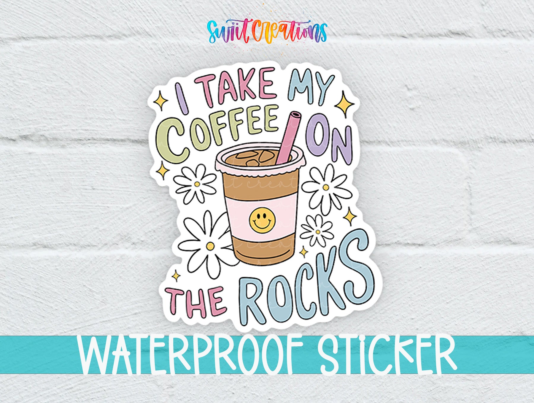 A colorful sticker with the text "I TAKE MY COFFEE ON THE ROCKS" and a coffee cup with a smiley face.