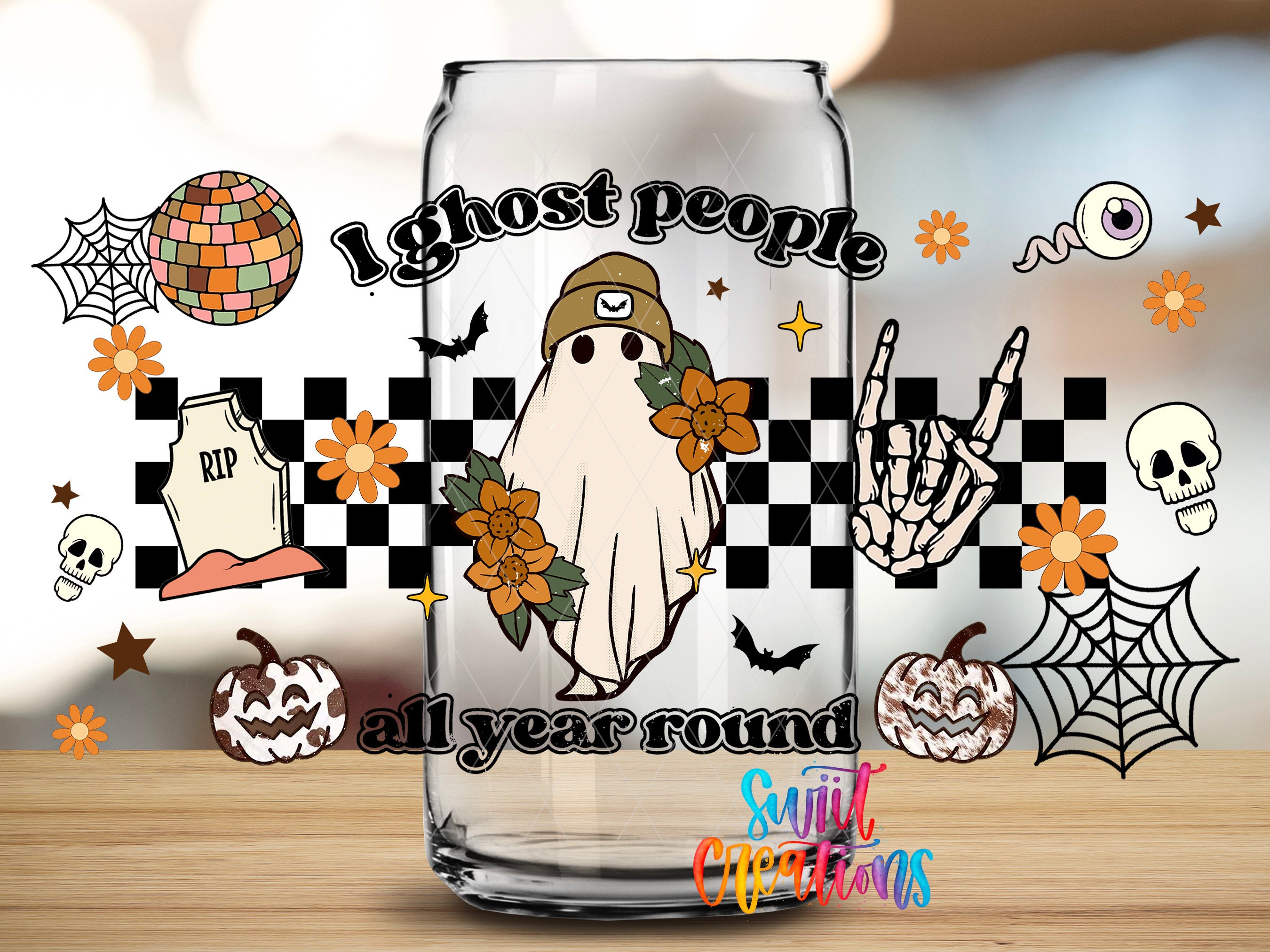 a glass can with a Halloween-themed design, including a ghost, skeleton, spider web, and various other Halloween symbols.