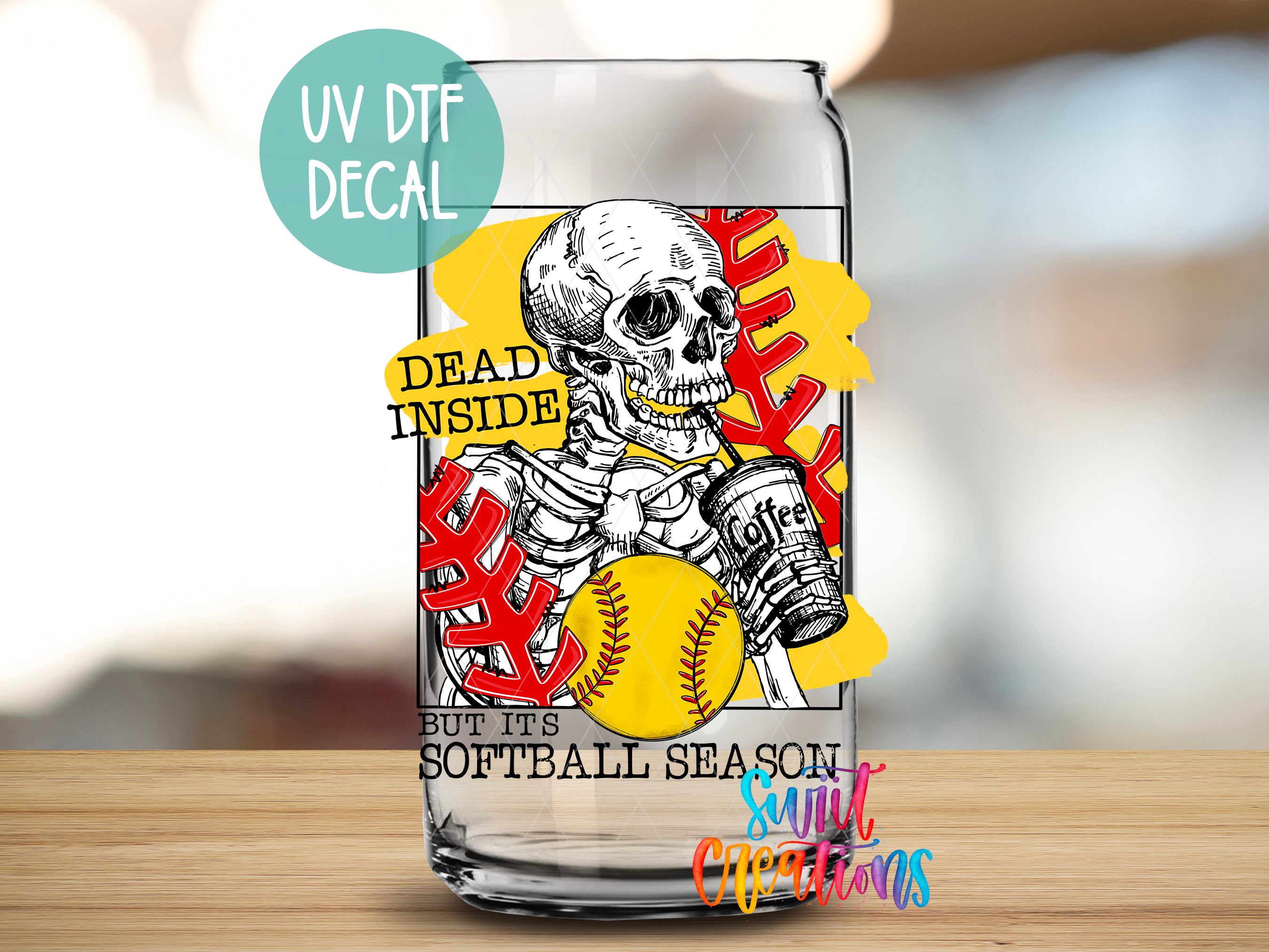 a glass with a picture of a skeleton holding a baseball
