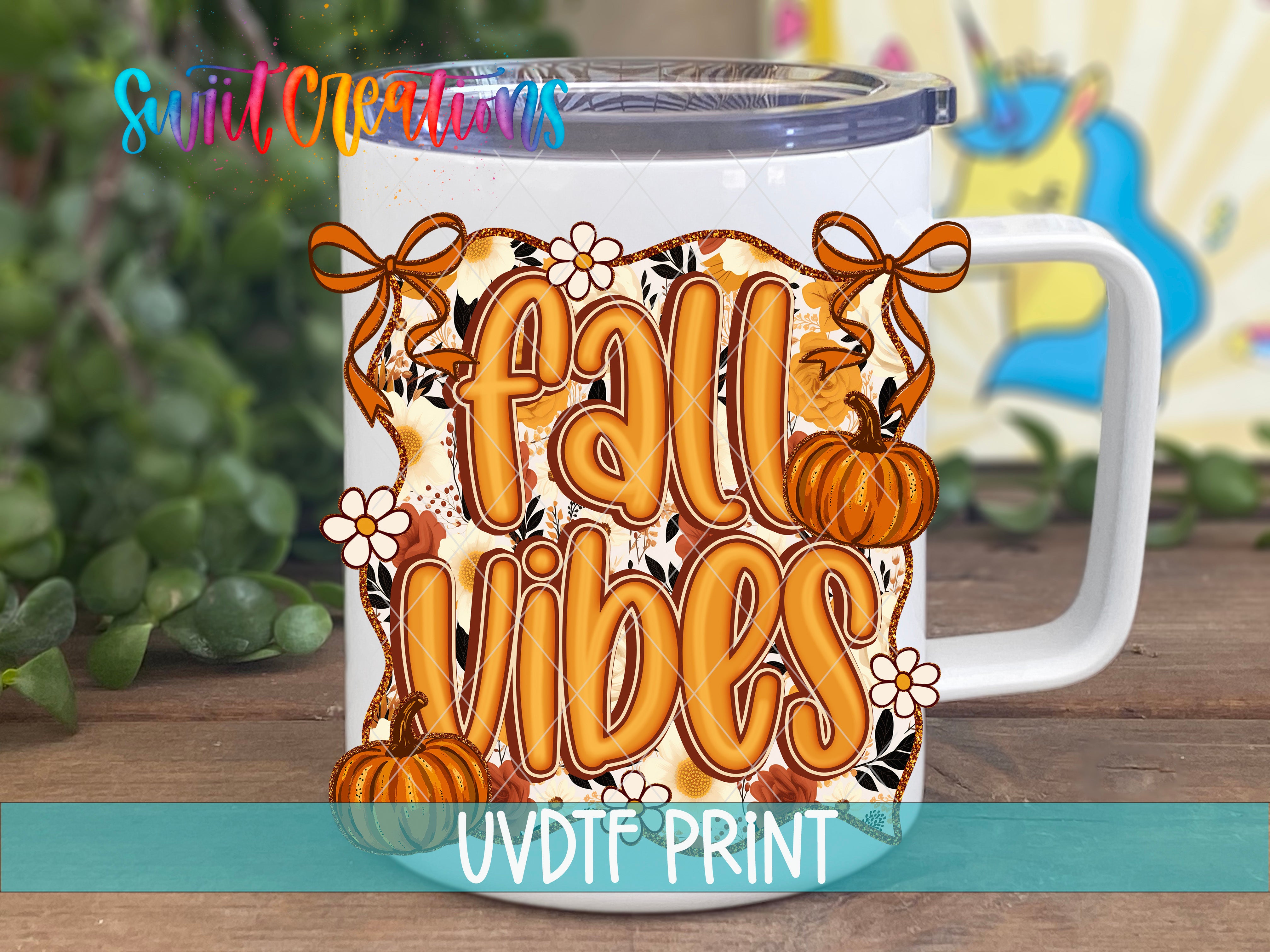 A white mug with a colorful fall-themed design, including pumpkins, flowers, and the text "Fall Vibes".