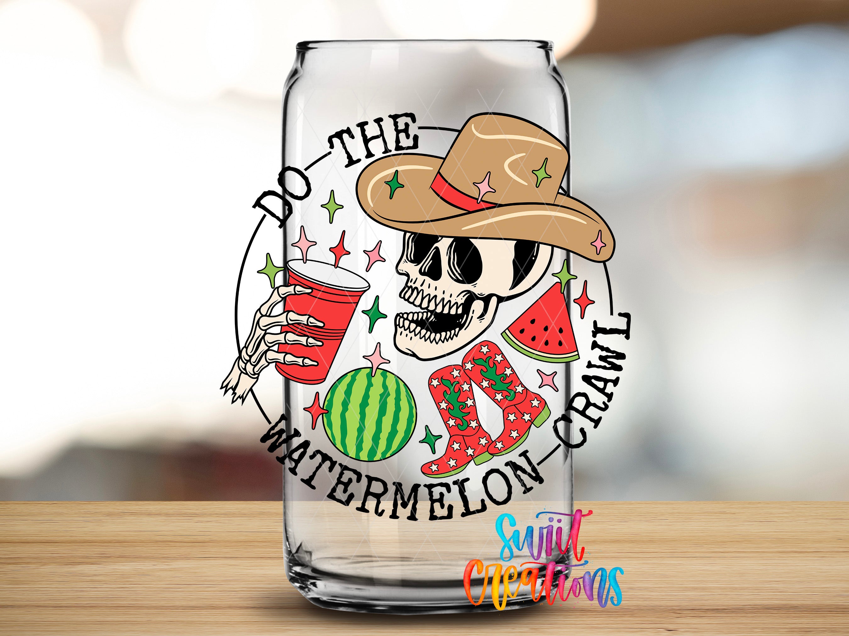a glass with a skull wearing a cowboy hat and holding a red cup, surrounded by various objects such as a watermelon, cowboy boots, and a star.