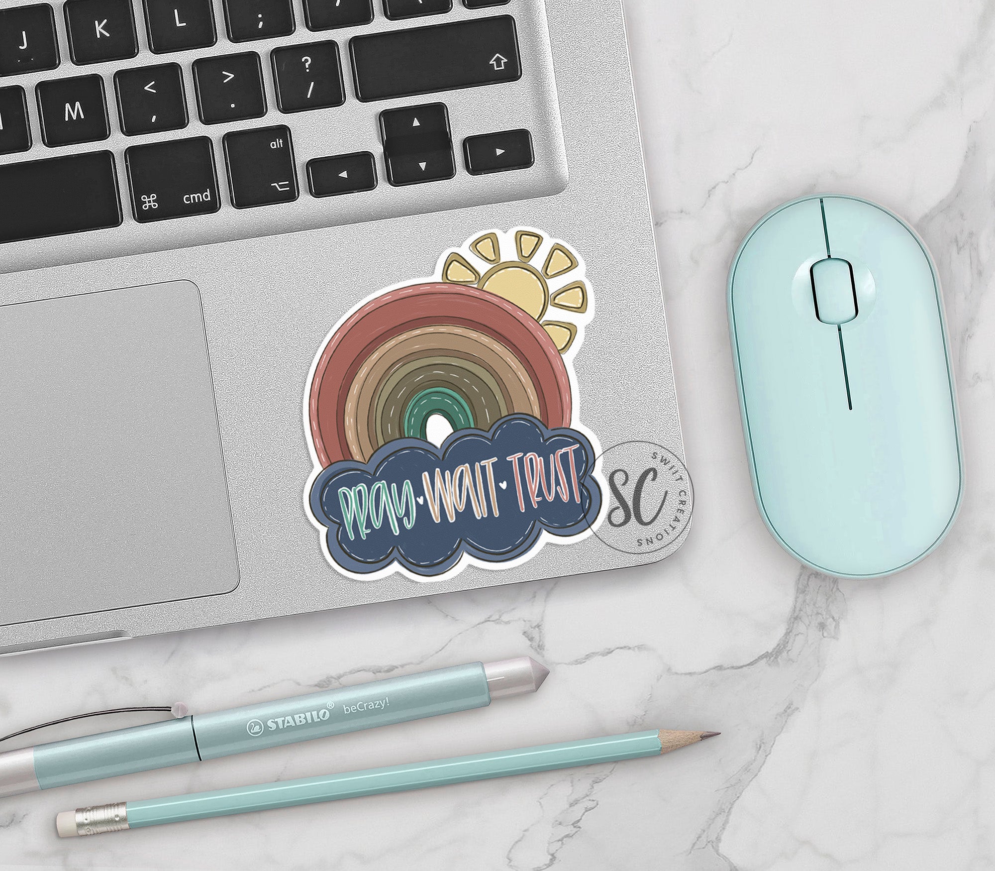 a laptop computer sitting next to a mouse and keyboard