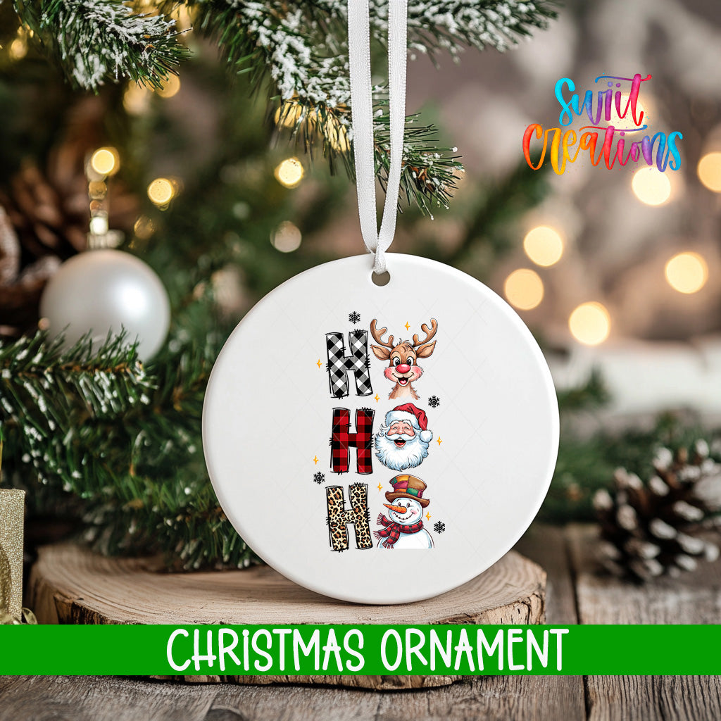 A white Christmas ornament with the word "HAPPY" spelled out in a decorative font, surrounded by various holiday-themed illustrations such as reindeer, Santa Claus, and a snowman.