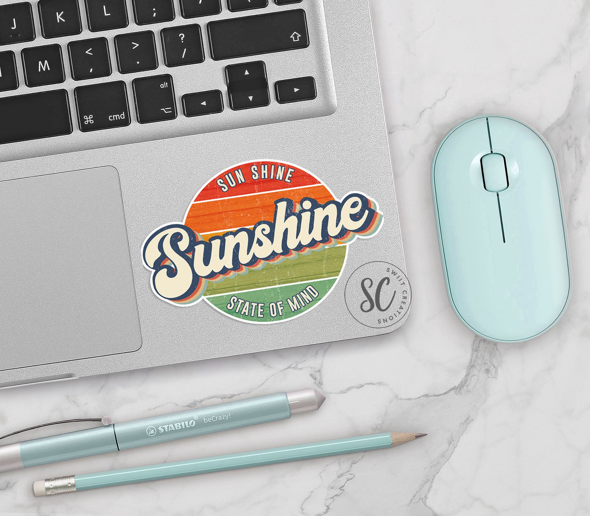 a laptop computer sitting on top of a white table