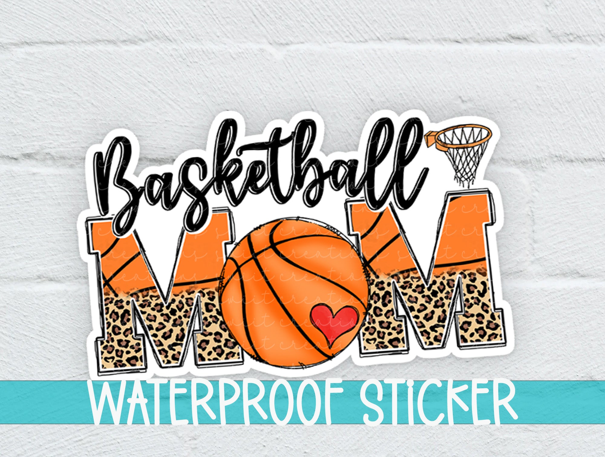 a basketball mom sticker on a white brick wall